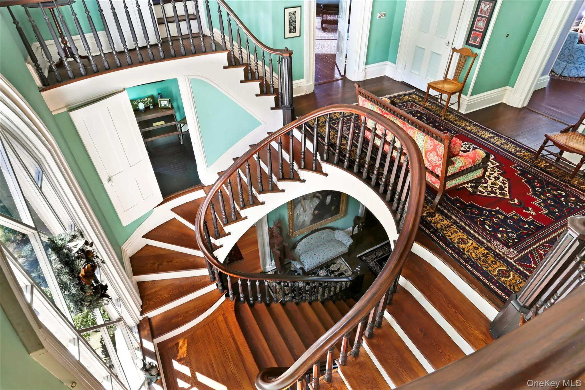 Staircase with wood finished floors and baseboards Staircase with wood finished floors and baseboards