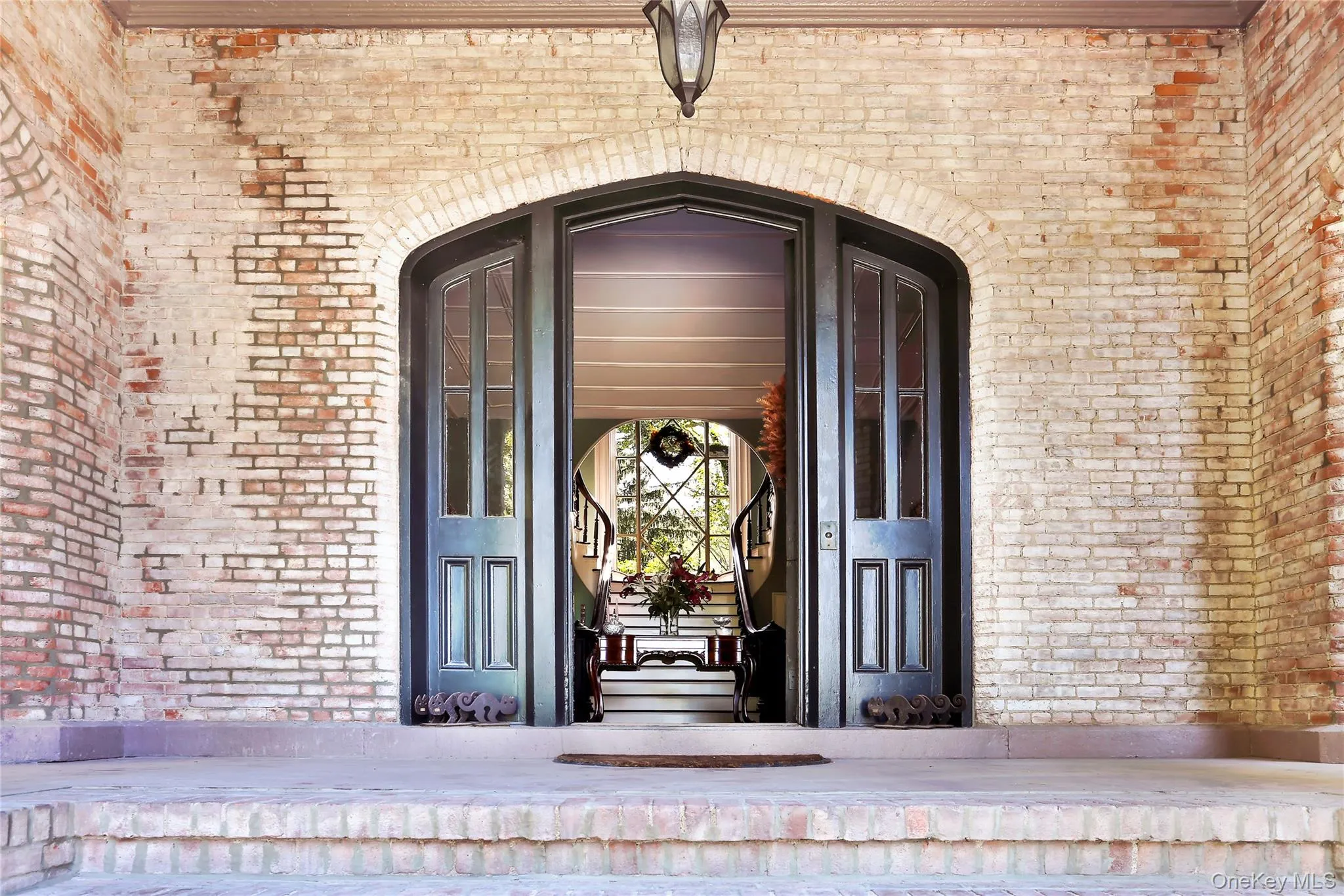 Property entrance with brick siding Property entrance with brick siding