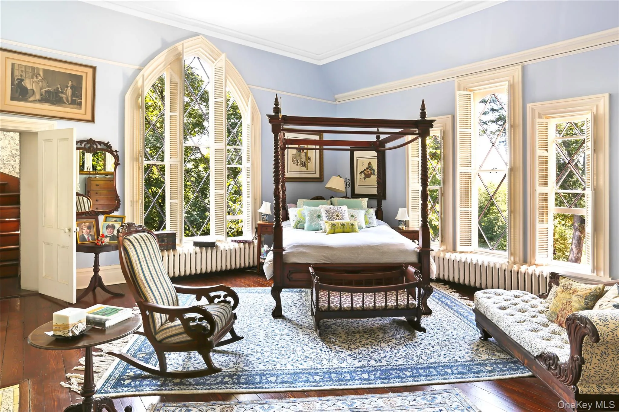 Bedroom with radiator, wood-type flooring, and crown molding Bedroom with radiator, wood-type flooring, and crown molding