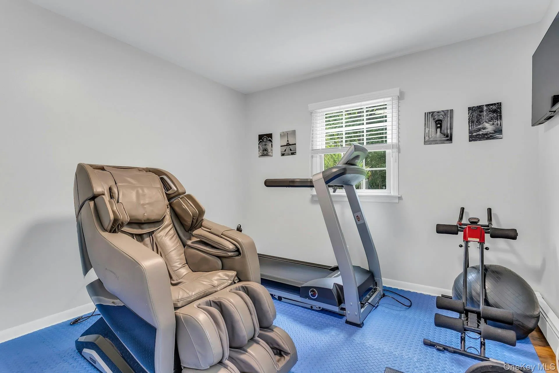 Workout area featuring baseboards Workout area featuring baseboards