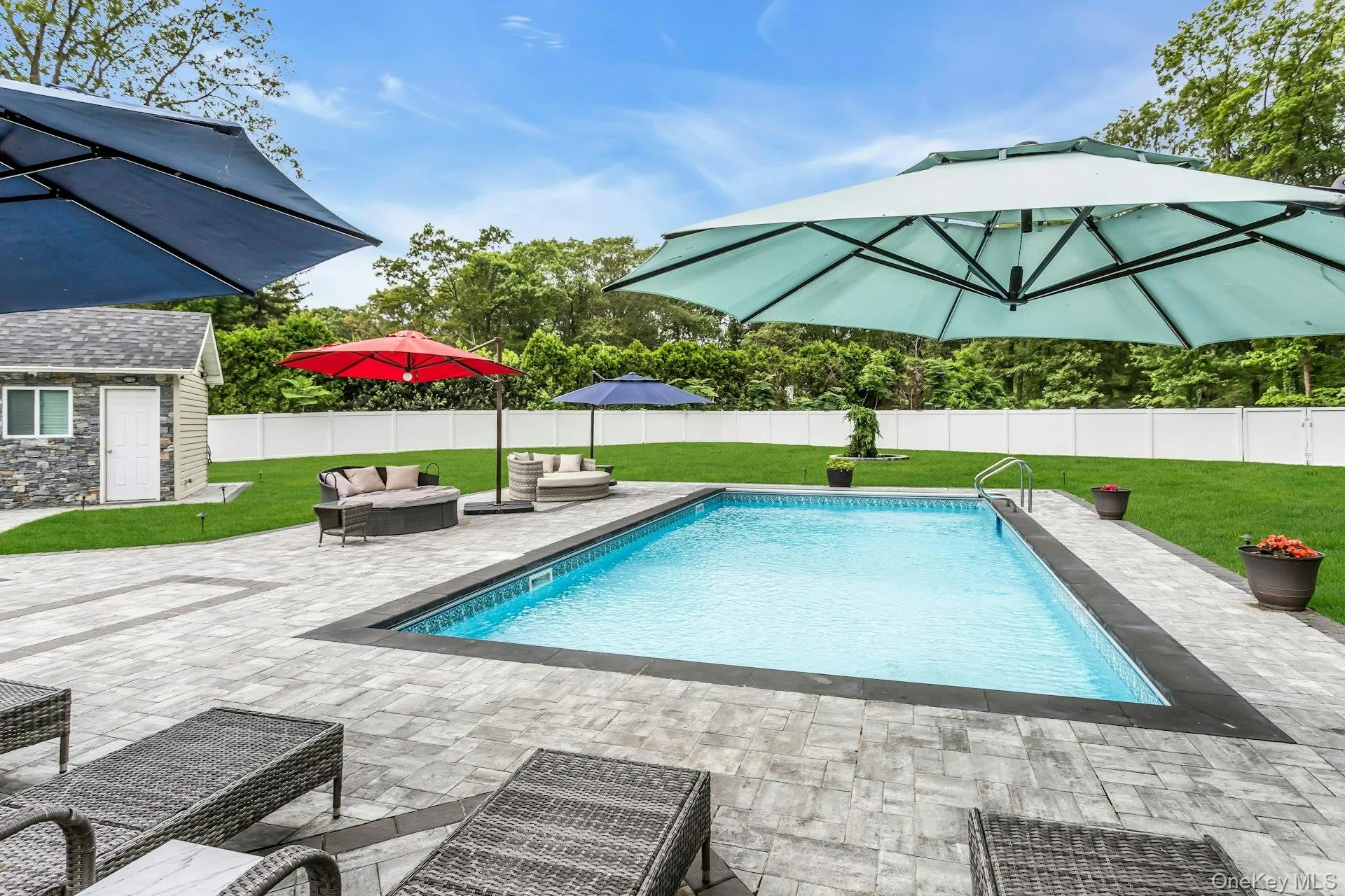 View of swimming pool with a patio, an outdoor structure, and an outdoor living space View of swimming pool with a patio, an outdoor structure, and an outdoor living space