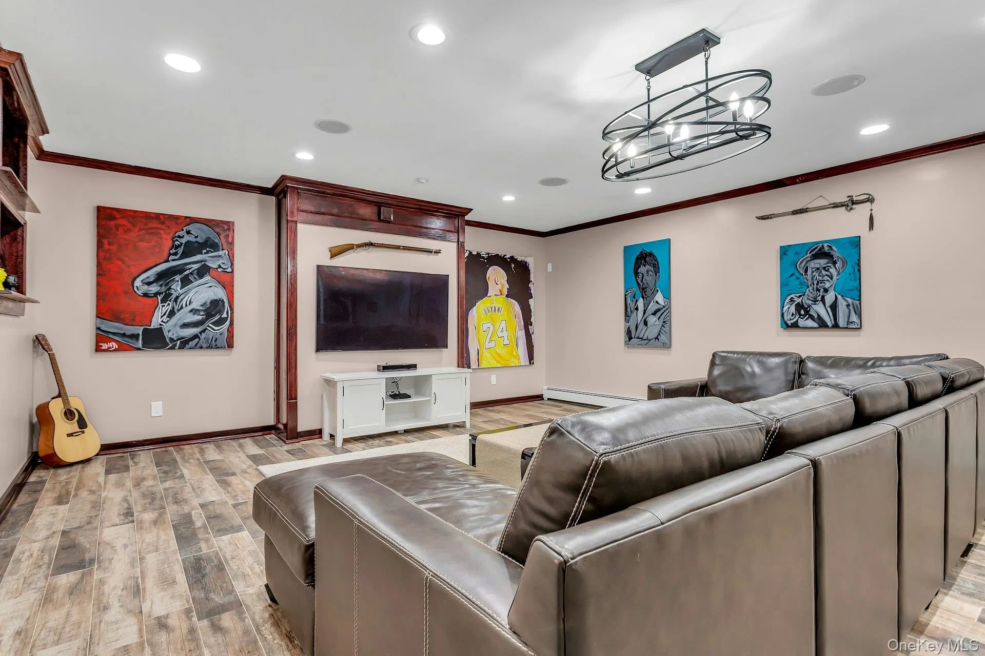 Living room with crown molding, baseboards, light wood-type flooring, recessed lighting, and baseboard heating Living room with crown molding, baseboards, light wood-type flooring, recessed lighting, and baseboard heating