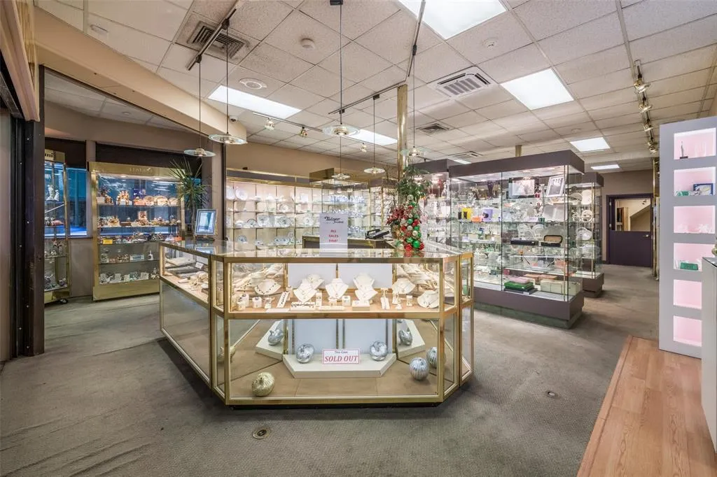 Miscellaneous room featuring track lighting, a drop ceiling, and carpet flooring Miscellaneous room featuring track lighting, a drop ceiling, and carpet flooring