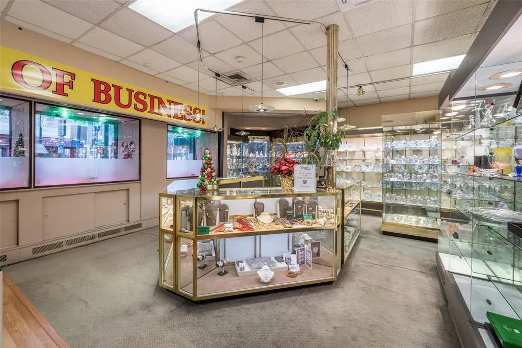 Miscellaneous room featuring a paneled ceiling and carpet flooring Miscellaneous room featuring a paneled ceiling and carpet flooring