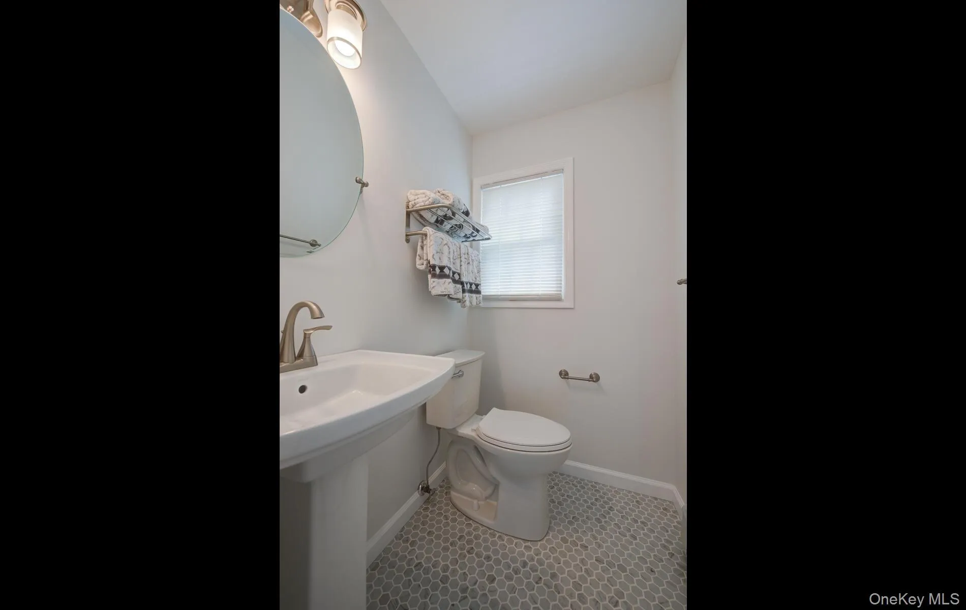 Half bath featuring toilet and baseboards Half bath featuring toilet and baseboards