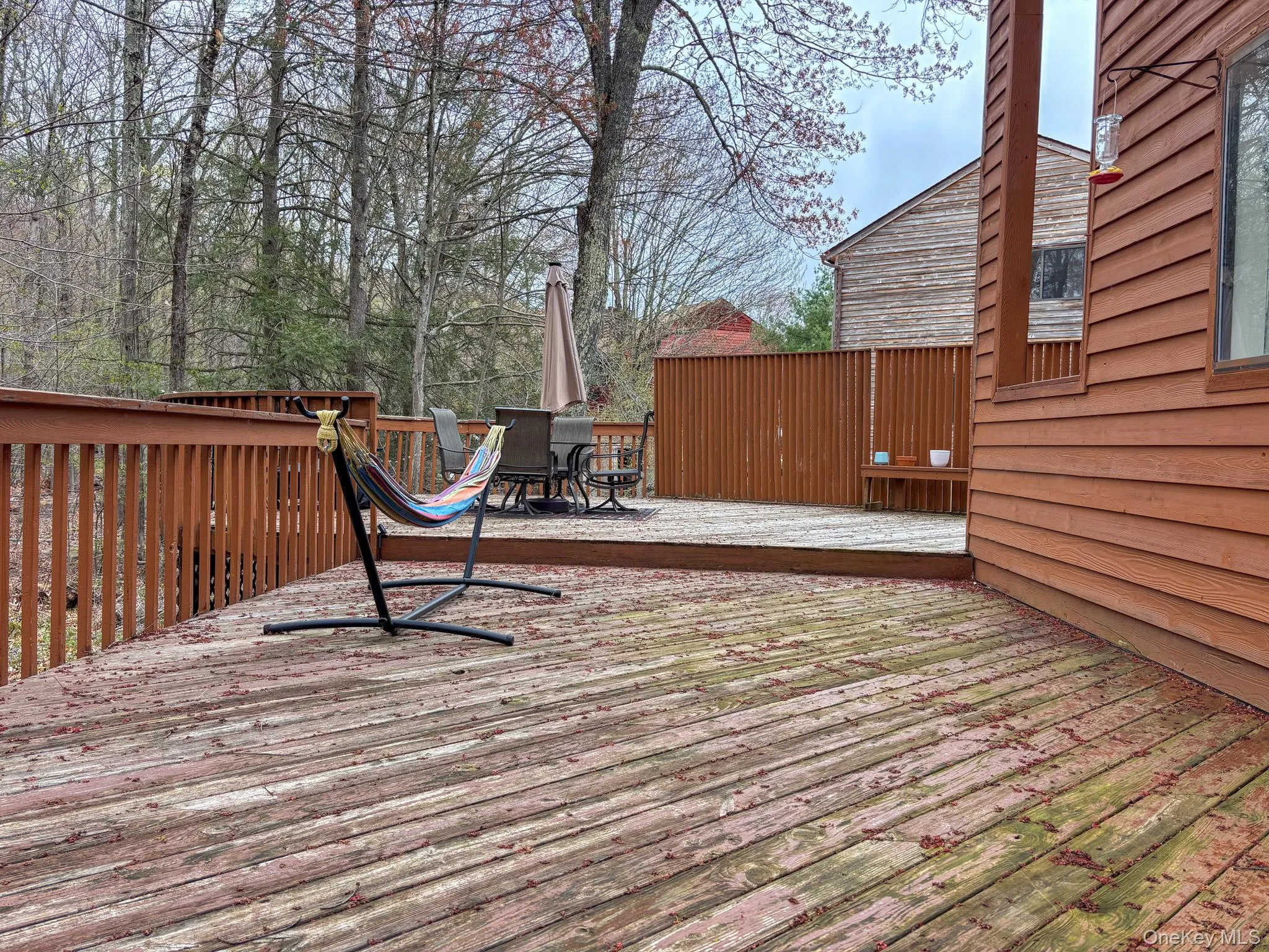 Wooden deck featuring outdoor dining area Wooden deck featuring outdoor dining area