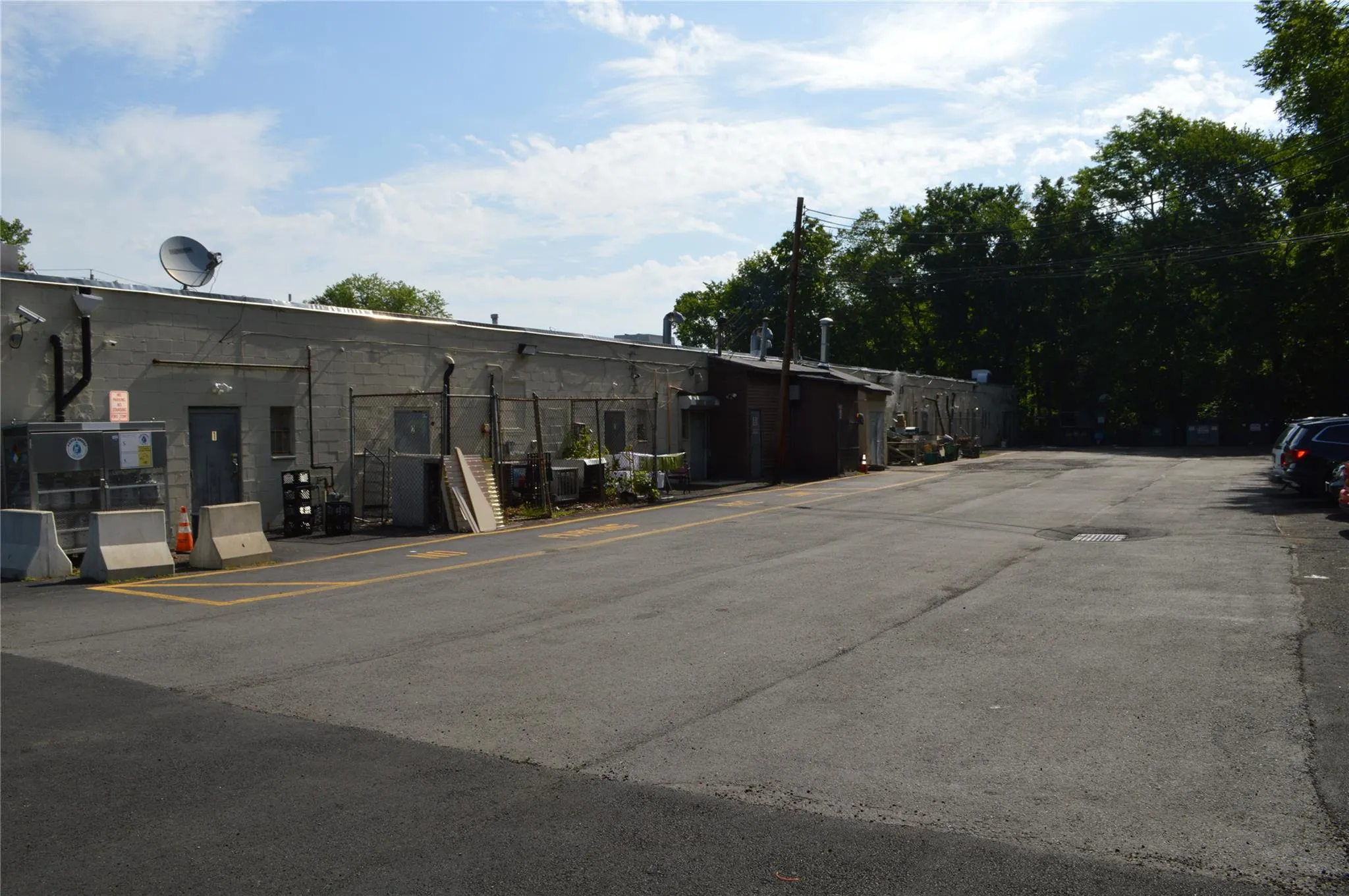 View of property featuring uncovered parking View of property featuring uncovered parking