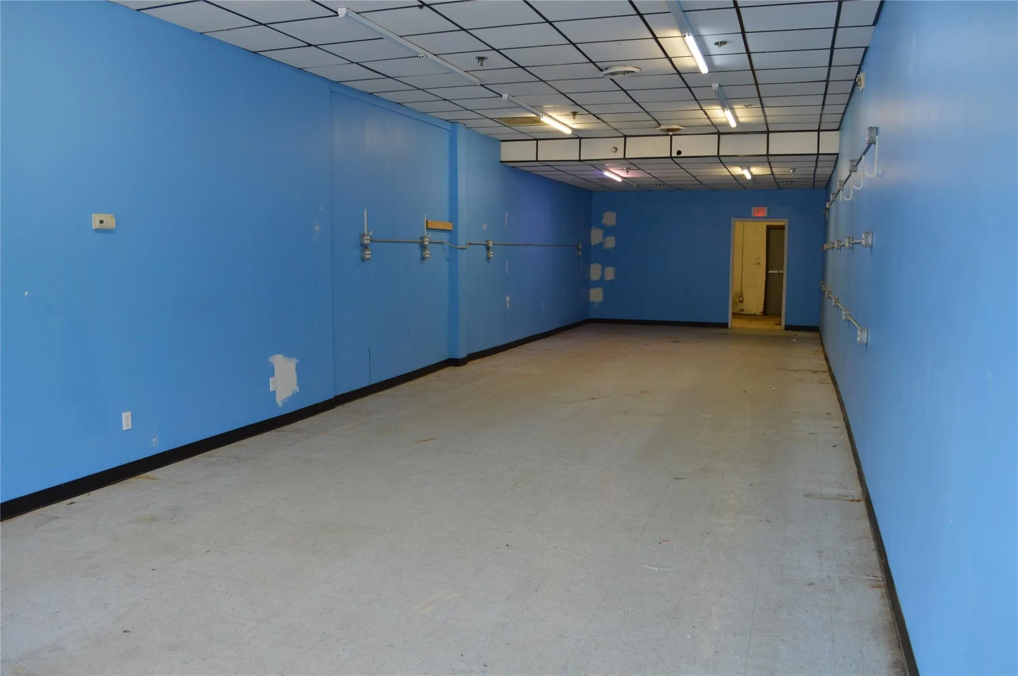 Empty room featuring light floors and baseboards Empty room featuring light floors and baseboards
