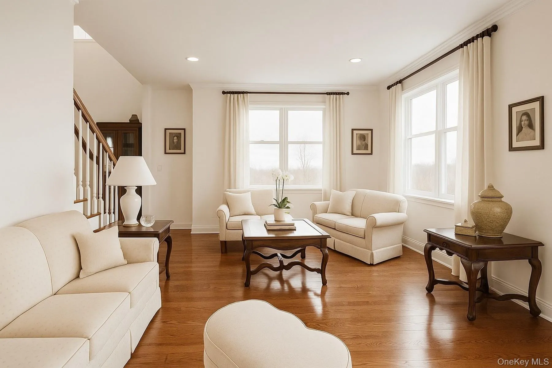 Living area with wood finished floors, stairs, recessed lighting, and ornamental molding Living area with wood finished floors, stairs, recessed lighting, and ornamental molding