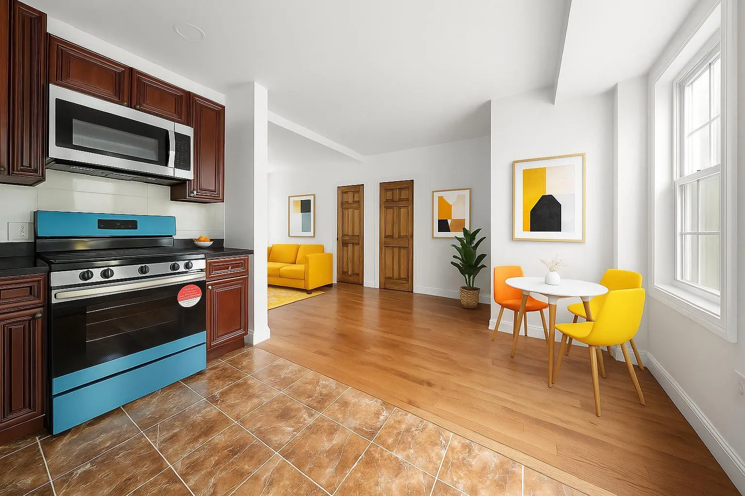 Kitchen with stainless steel appliances, dark countertops, and plenty of natural light Kitchen with stainless steel appliances, dark countertops, and plenty of natural light