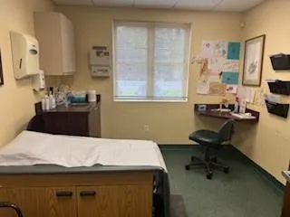Carpeted bedroom with a paneled ceiling Carpeted bedroom with a paneled ceiling