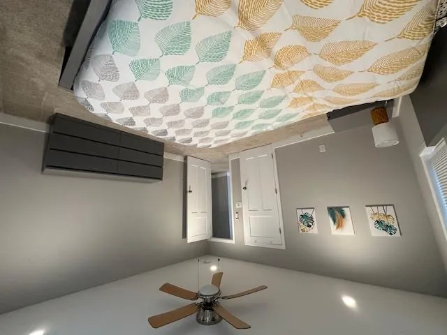 Bedroom with light colored carpet, recessed lighting, baseboards, and a ceiling fan Bedroom with light colored carpet, recessed lighting, baseboards, and a ceiling fan