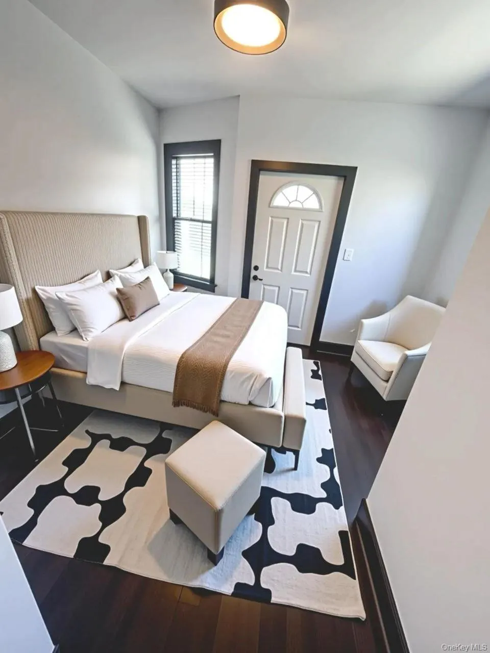 Bedroom featuring dark wood-style floors Bedroom featuring dark wood-style floors