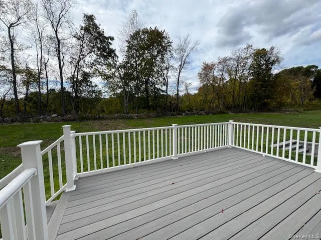Wooden deck with a yard Wooden deck with a yard