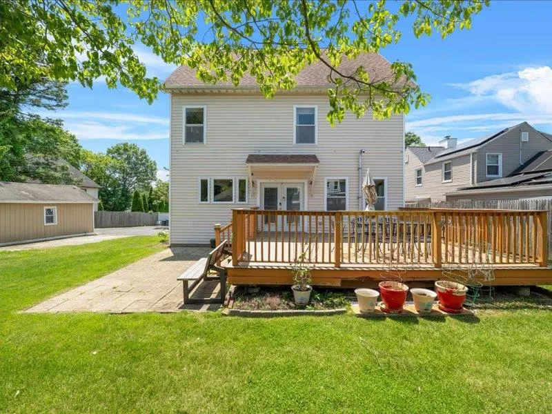 Back of house featuring french doors, a patio, and a deck Back of house featuring french doors, a patio, and a deck