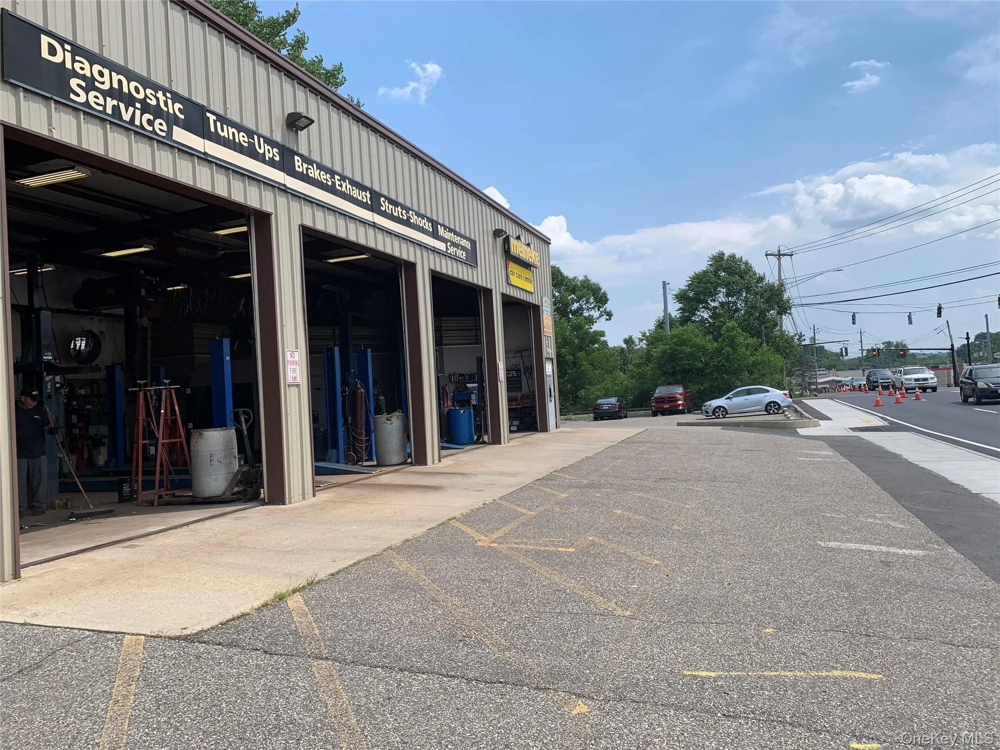 View of property featuring uncovered parking View of property featuring uncovered parking