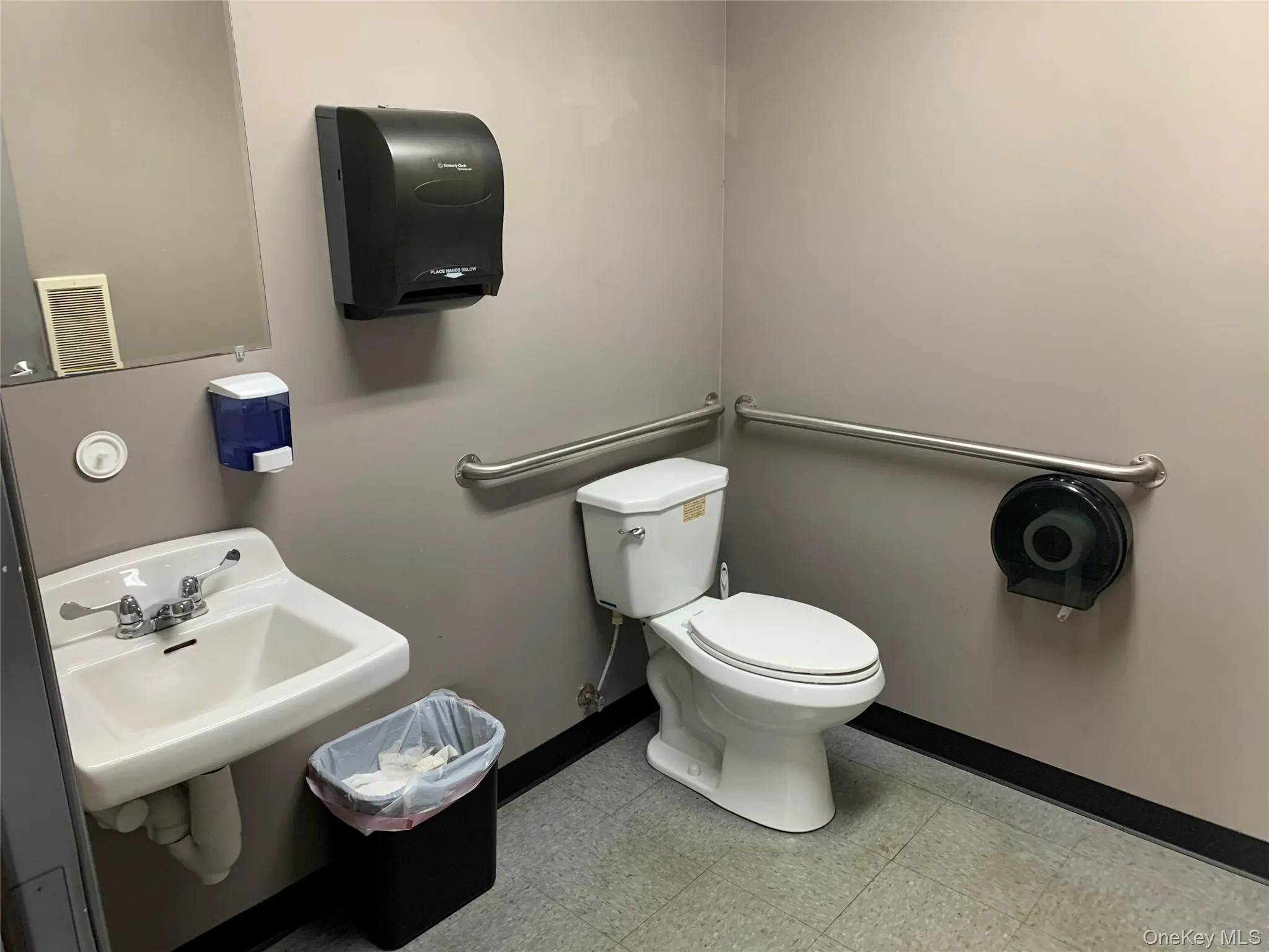 Half bath featuring toilet, baseboards, and tile patterned floors Half bath featuring toilet, baseboards, and tile patterned floors