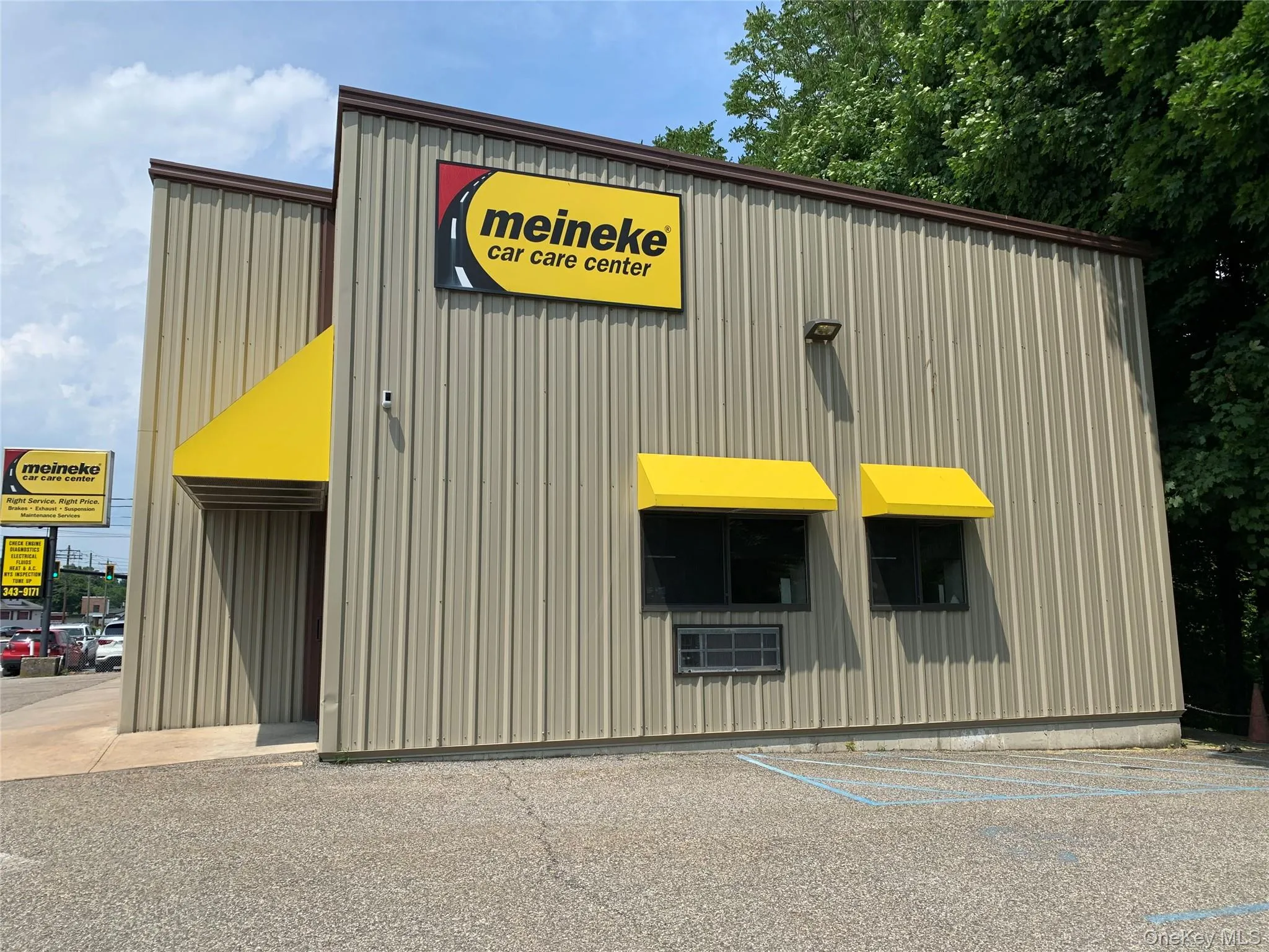 View of property with uncovered parking View of property with uncovered parking