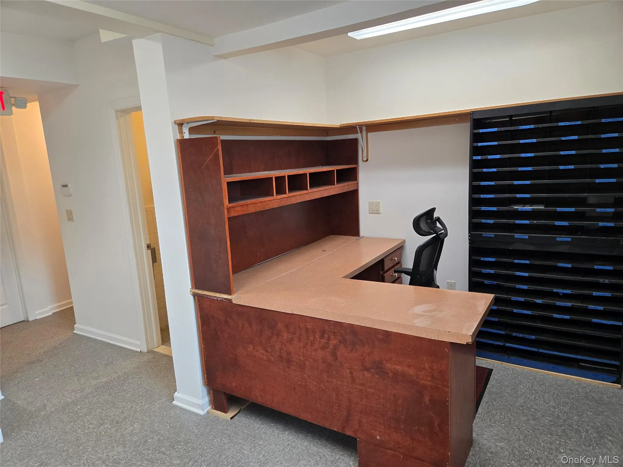 Office space with carpet and baseboards Office space with carpet and baseboards