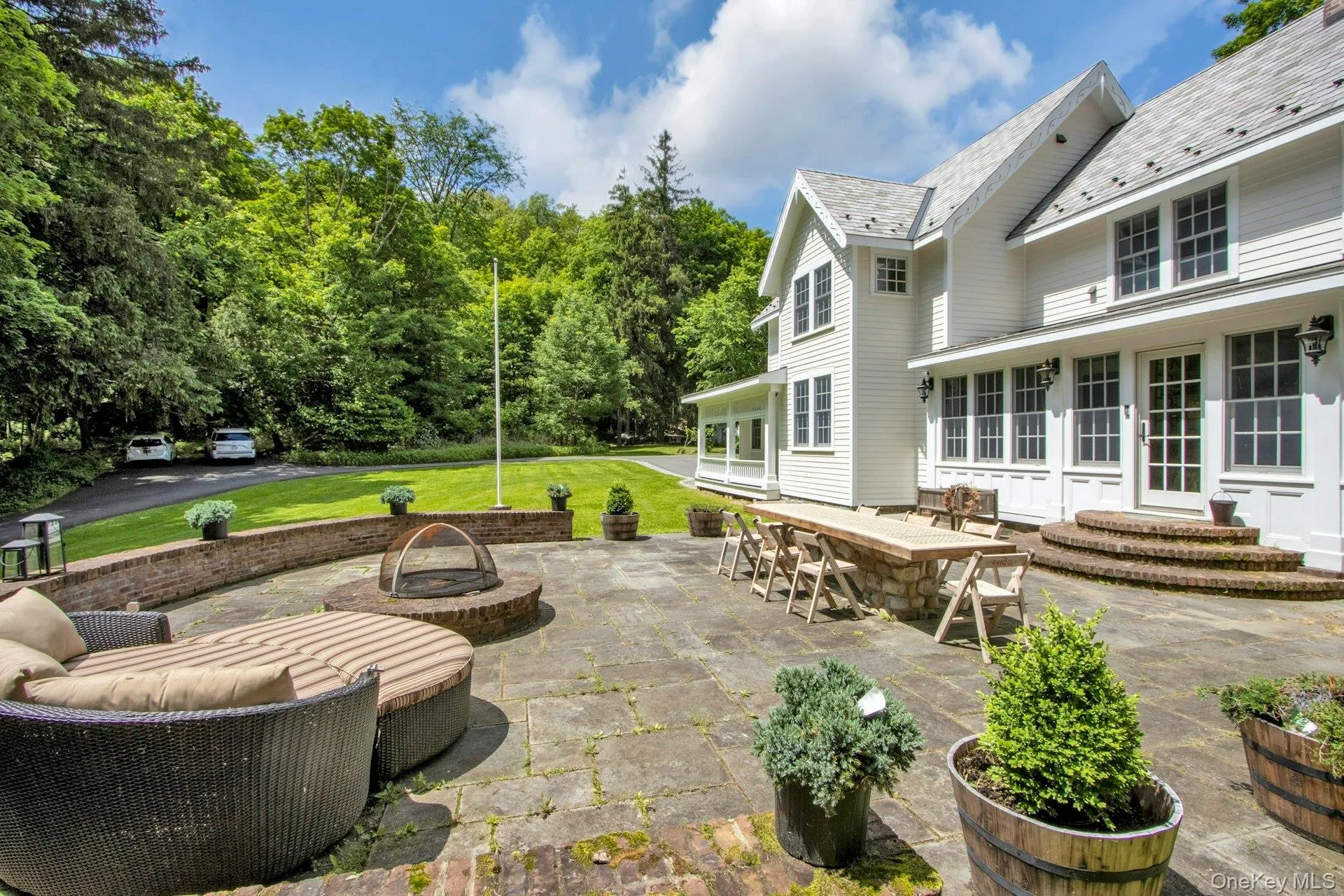 View of patio featuring an outdoor fire pit and entry steps View of patio featuring an outdoor fire pit and entry steps