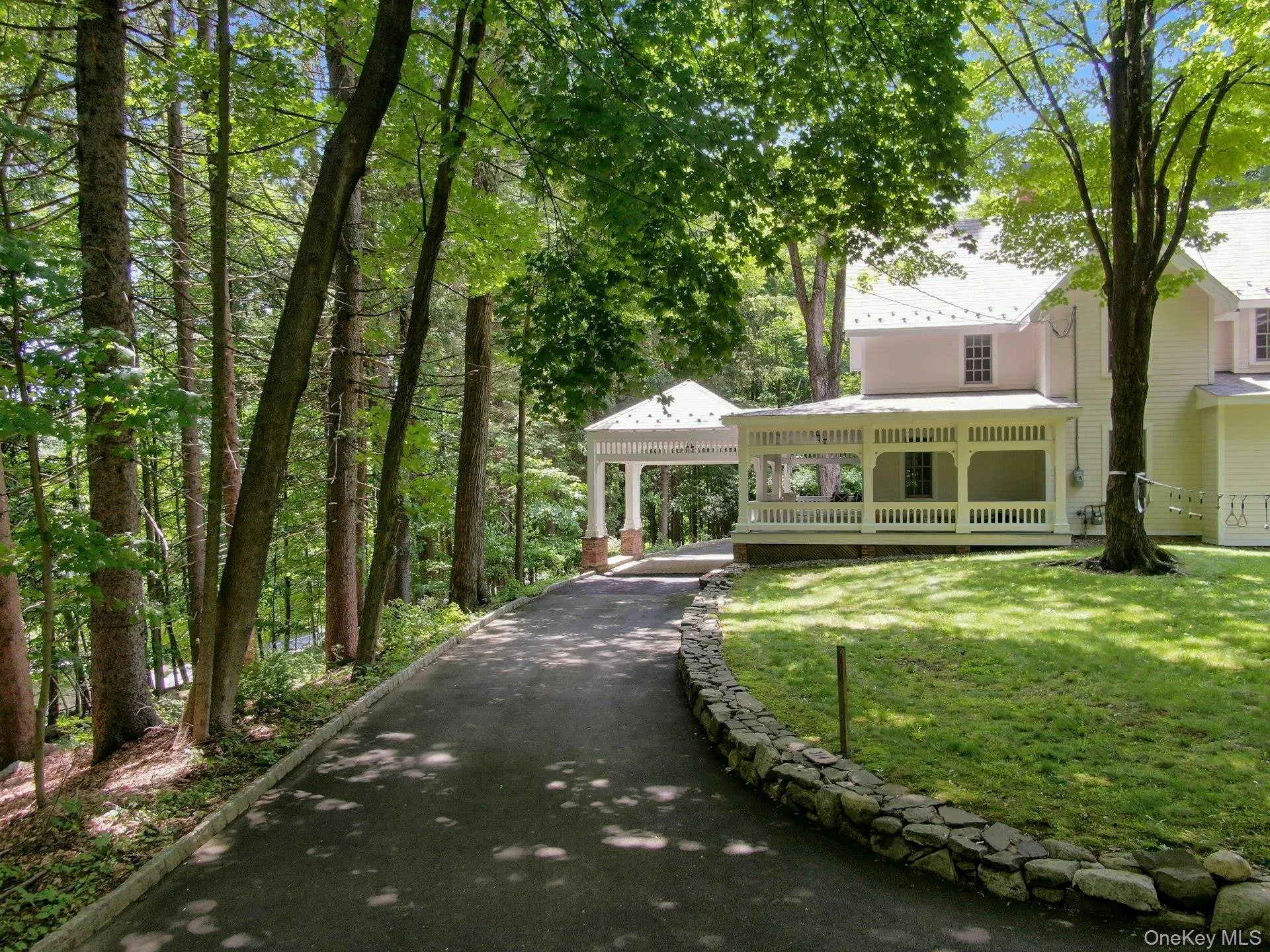 View of front of house with a front lawn and metal roof View of front of house with a front lawn and metal roof