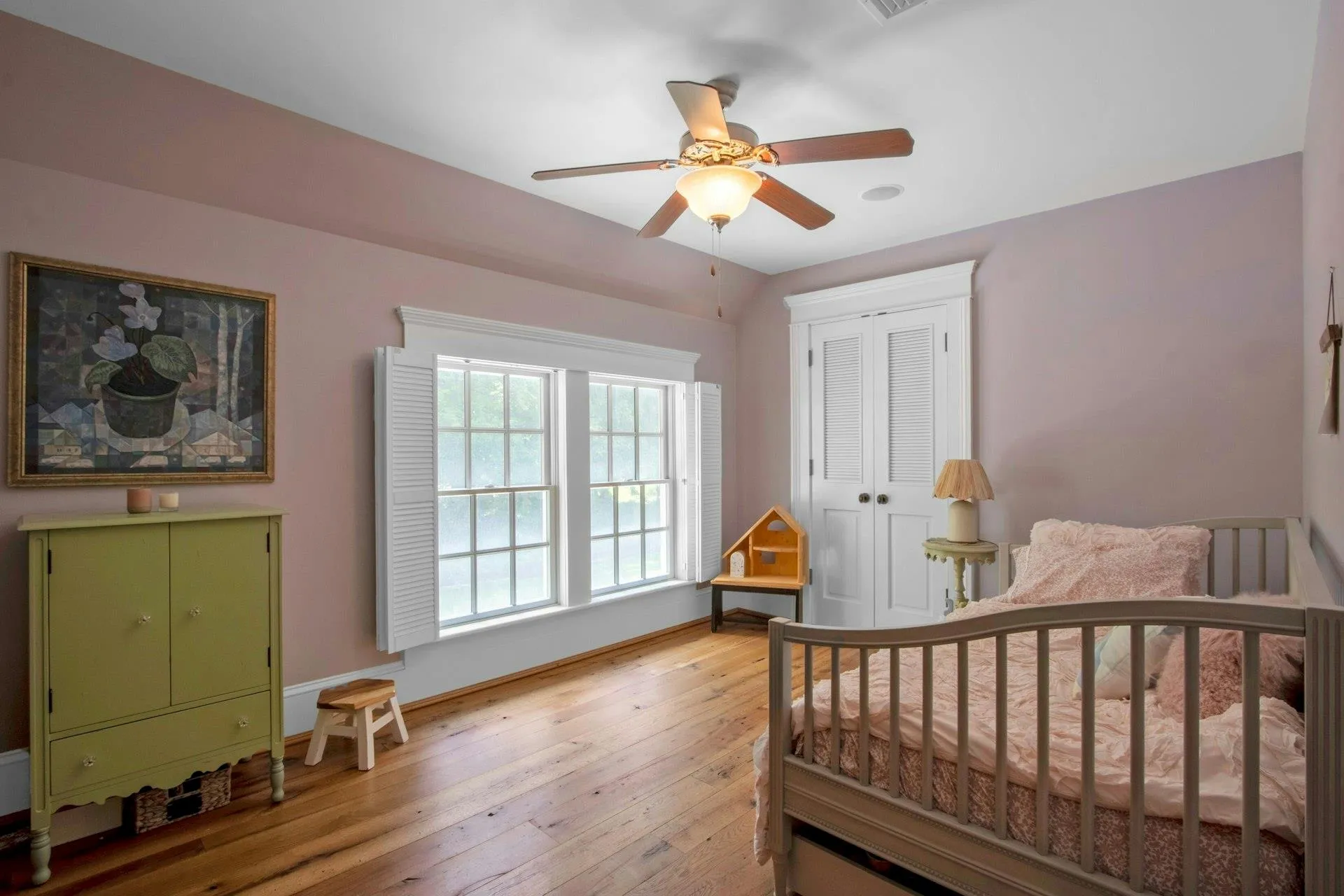 Bedroom featuring light wood-style floors, a closet, baseboards, and ceiling fan Bedroom featuring light wood-style floors, a closet, baseboards, and ceiling fan