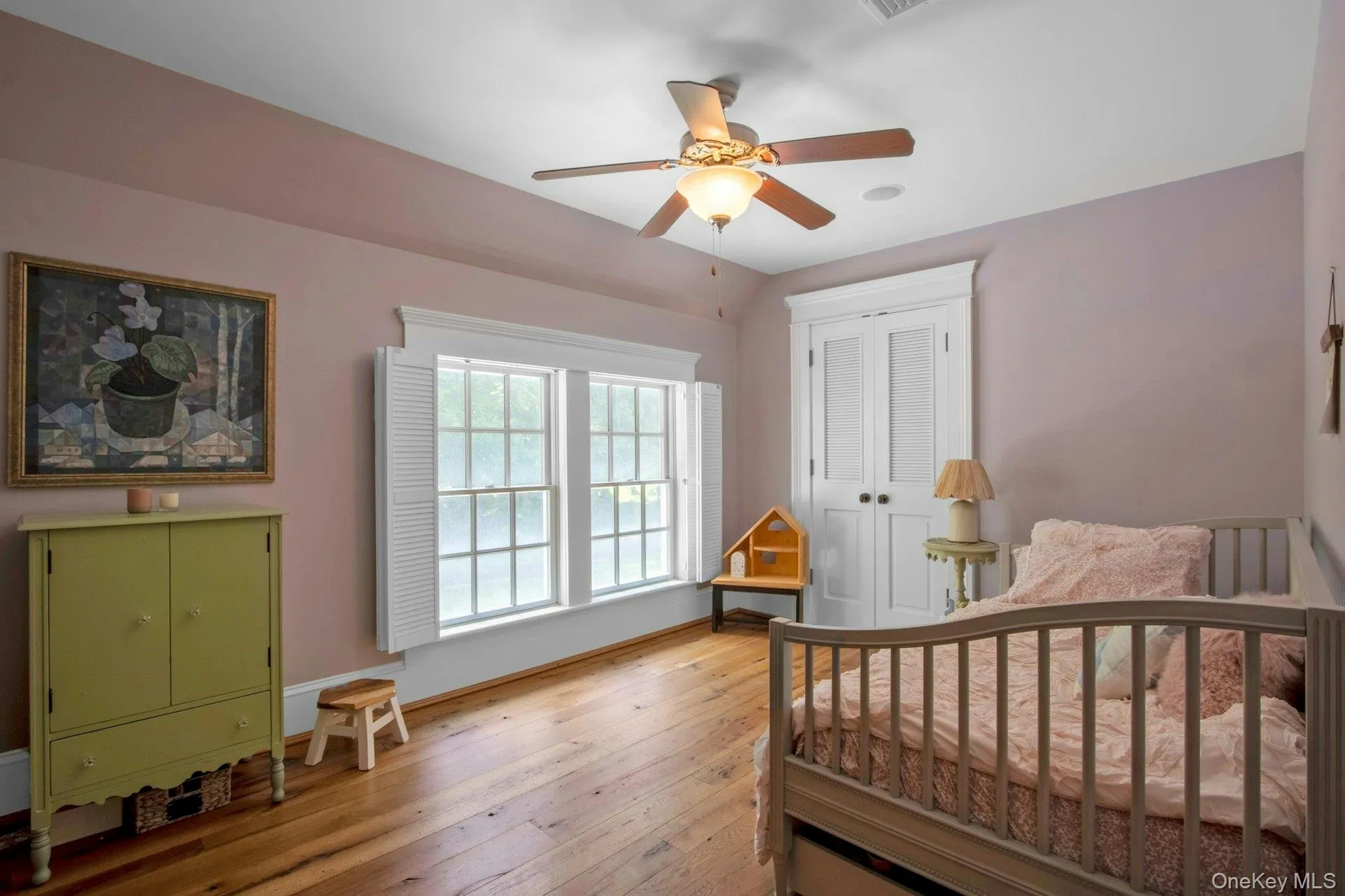 Bedroom featuring light wood-style floors, a closet, baseboards, and ceiling fan Bedroom featuring light wood-style floors, a closet, baseboards, and ceiling fan