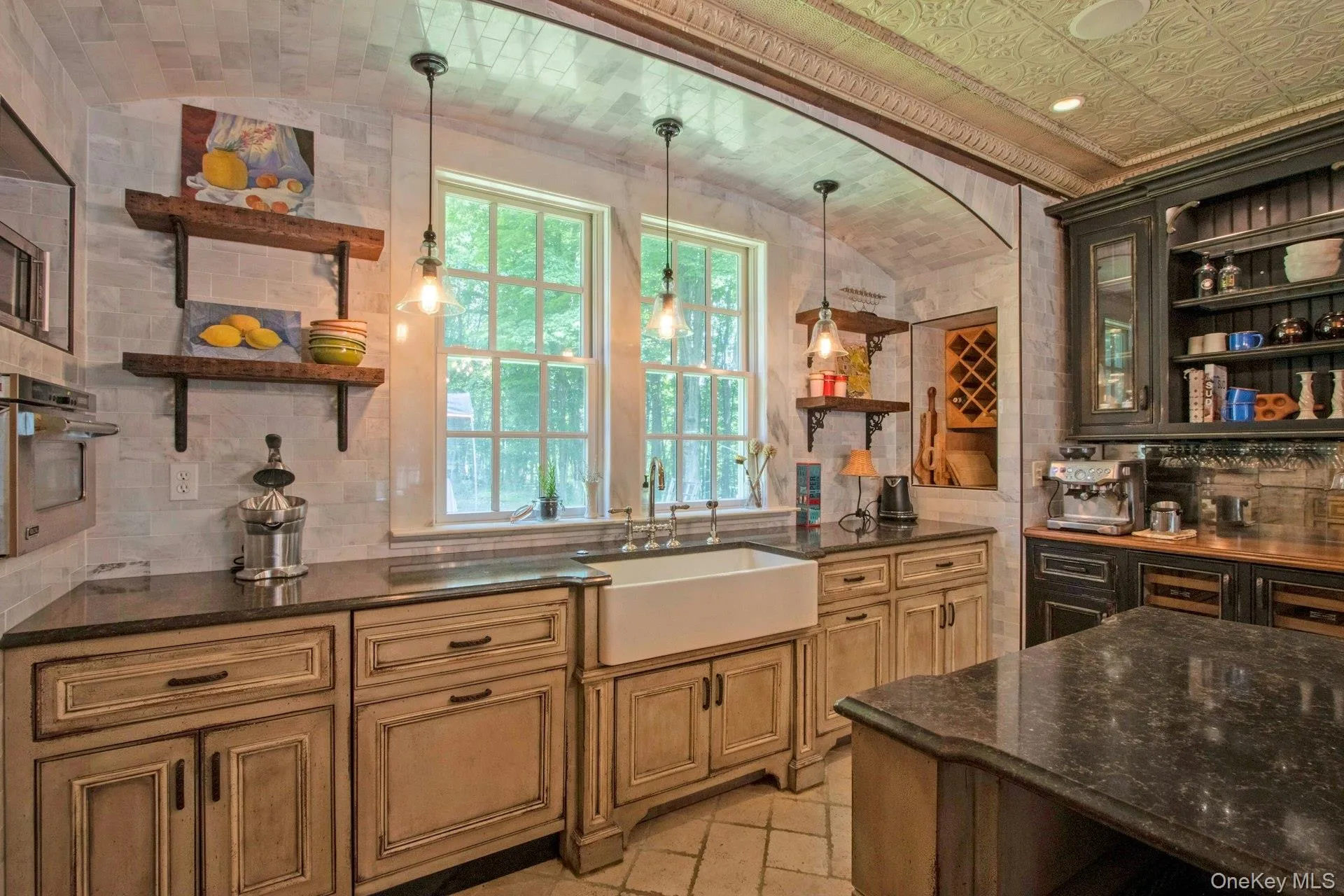 Kitchen featuring open shelves, a sink, stainless steel oven, tasteful backsplash, and vaulted ceiling Kitchen featuring open shelves, a sink, stainless steel oven, tasteful backsplash, and vaulted ceiling
