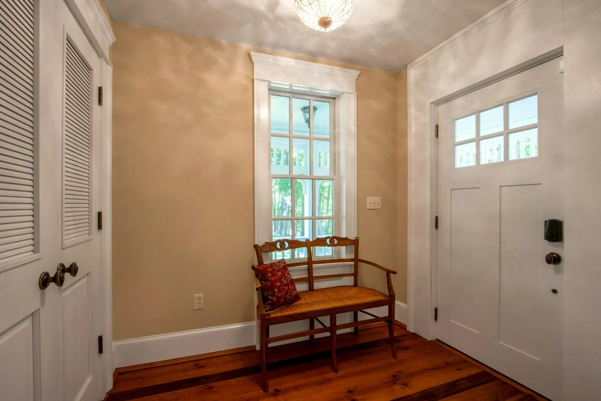 Entryway featuring wood-type flooring and baseboards Entryway featuring wood-type flooring and baseboards