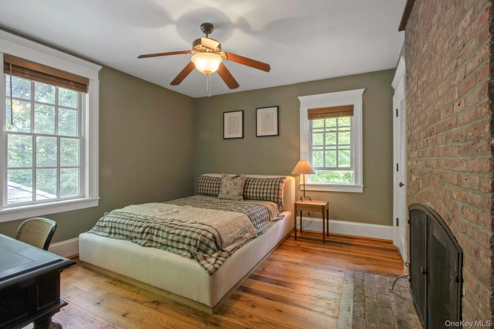 Bedroom with baseboards, hardwood / wood-style floors, and ceiling fan Bedroom with baseboards, hardwood / wood-style floors, and ceiling fan