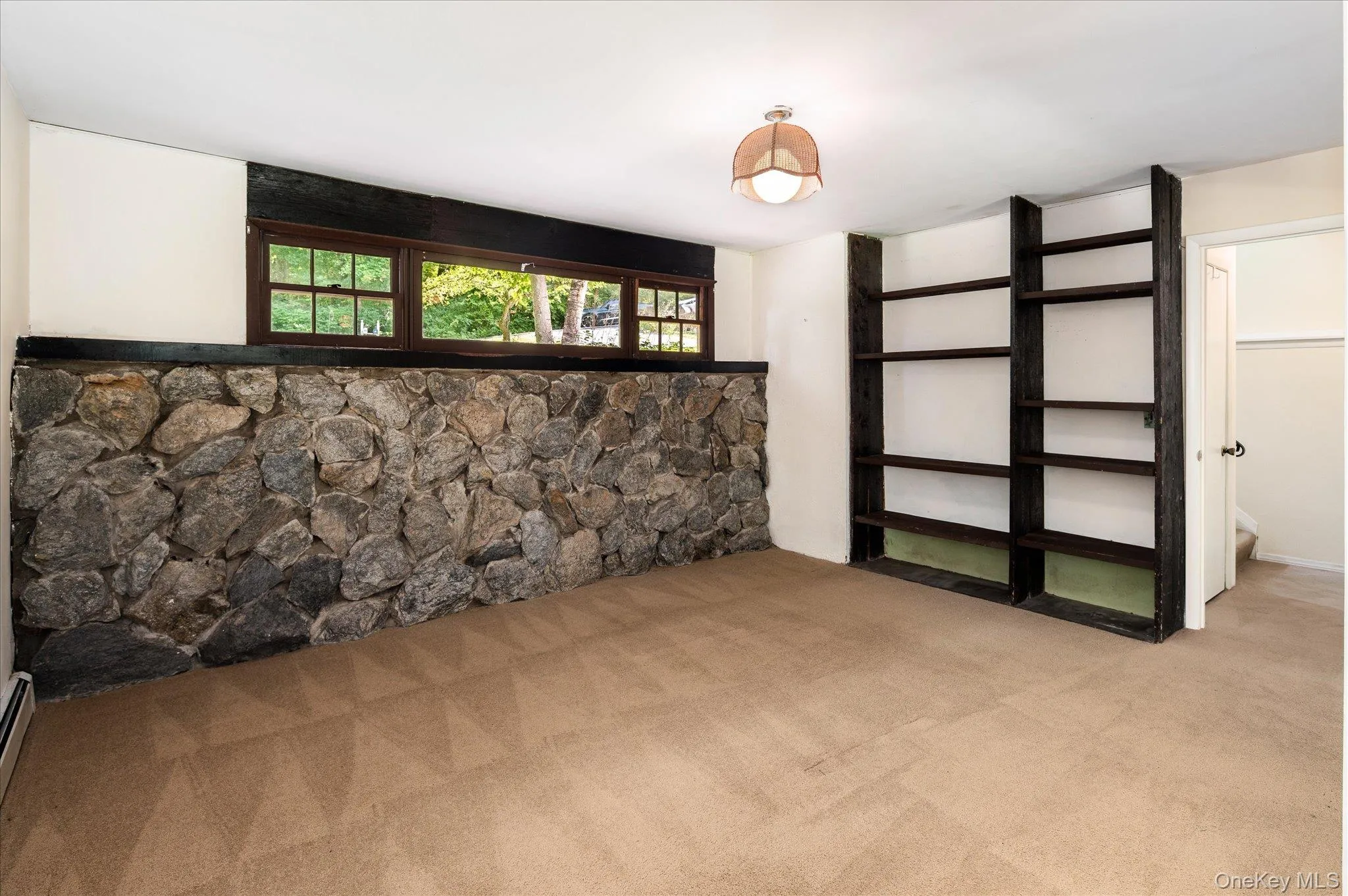 Lower Level with Stone Wall and Shelving Lower Level with Stone Wall and Shelving