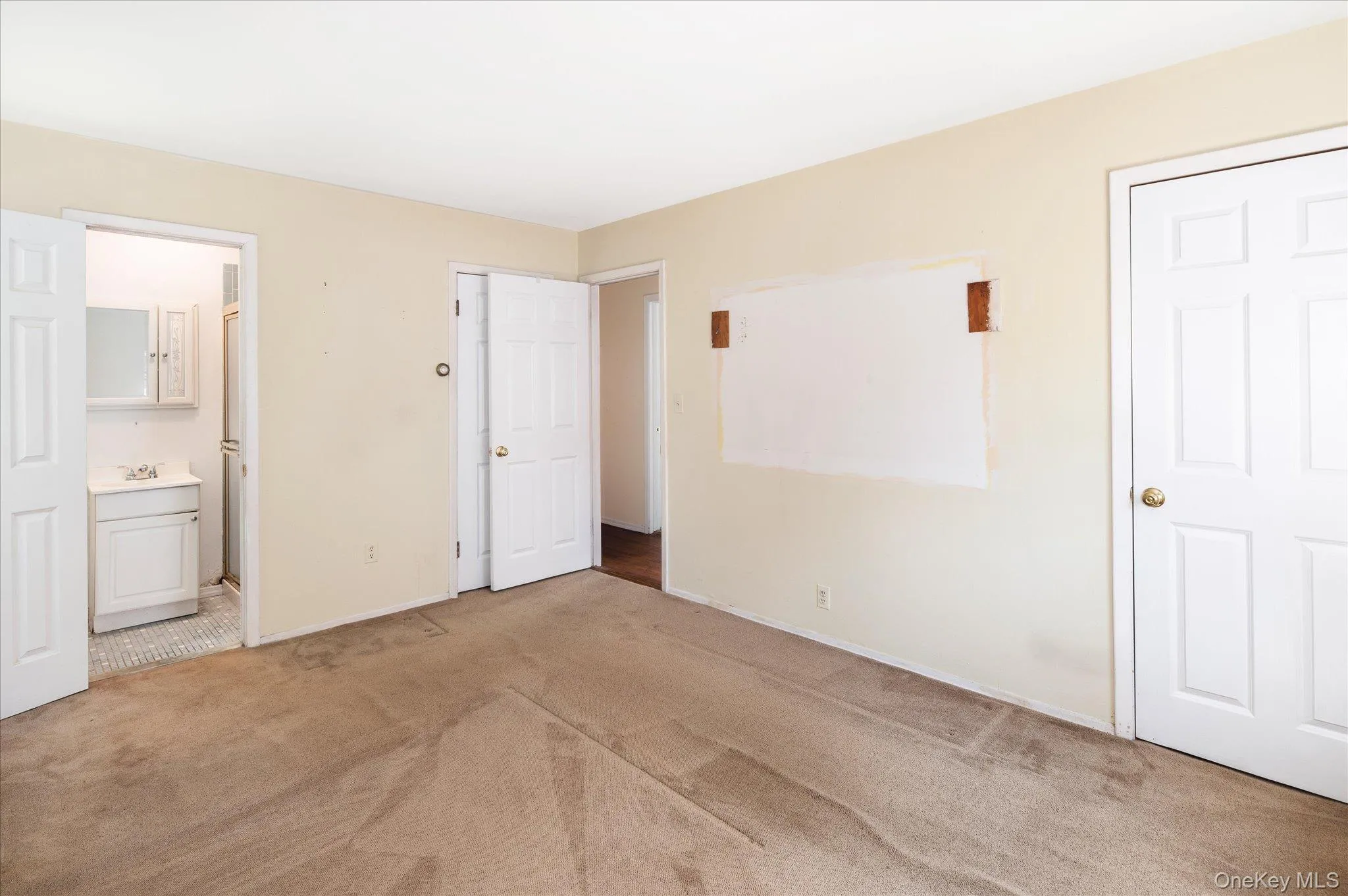 Primary Bedroom - Wood floors underneath carpet. Primary Bedroom - Wood floors underneath carpet.