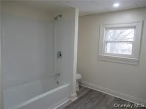 Full bathroom with shower / bathtub combination picture when apt vacant Full bathroom with shower / bathtub combination picture when apt vacant