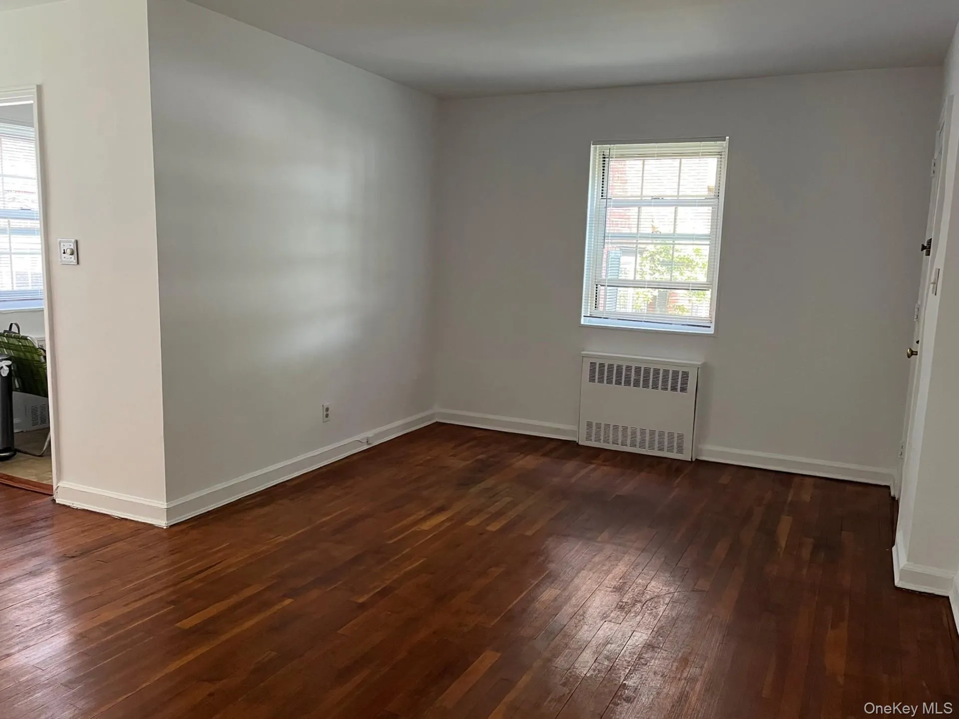 Radiator heating unit, hardwood / wood-style floors, and baseboards Radiator heating unit, hardwood / wood-style floors, and baseboards