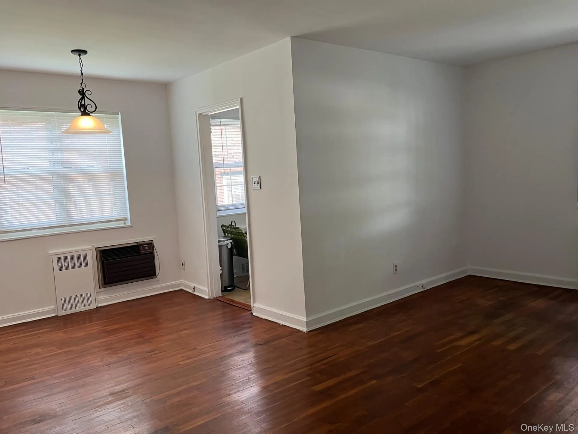Living room/dining room with hardwood flooring throughout Living room/dining room with hardwood flooring throughout
