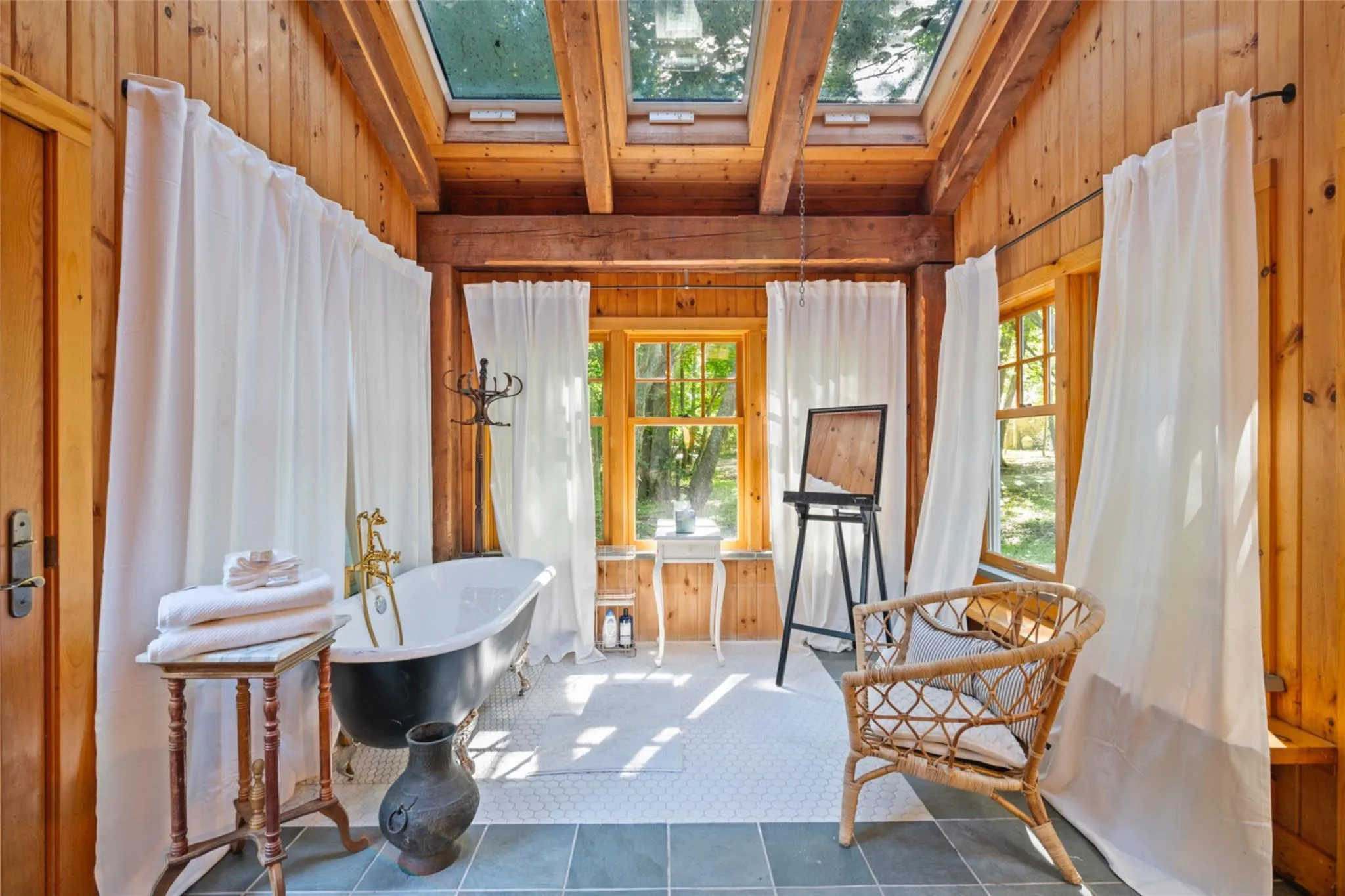 Sunroom / solarium featuring a skylight Sunroom / solarium featuring a skylight