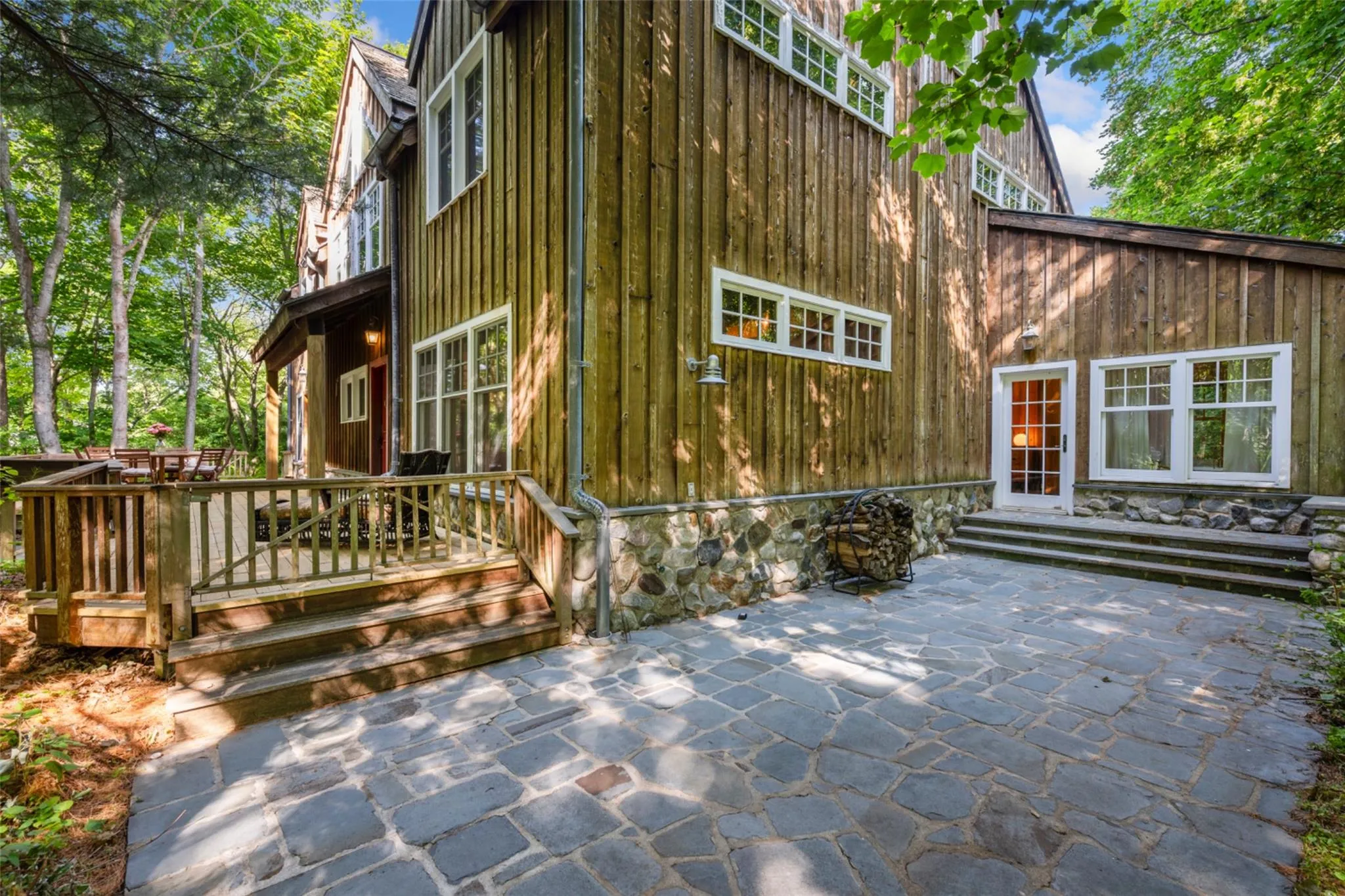 Rear view of house featuring a patio and a deck Rear view of house featuring a patio and a deck
