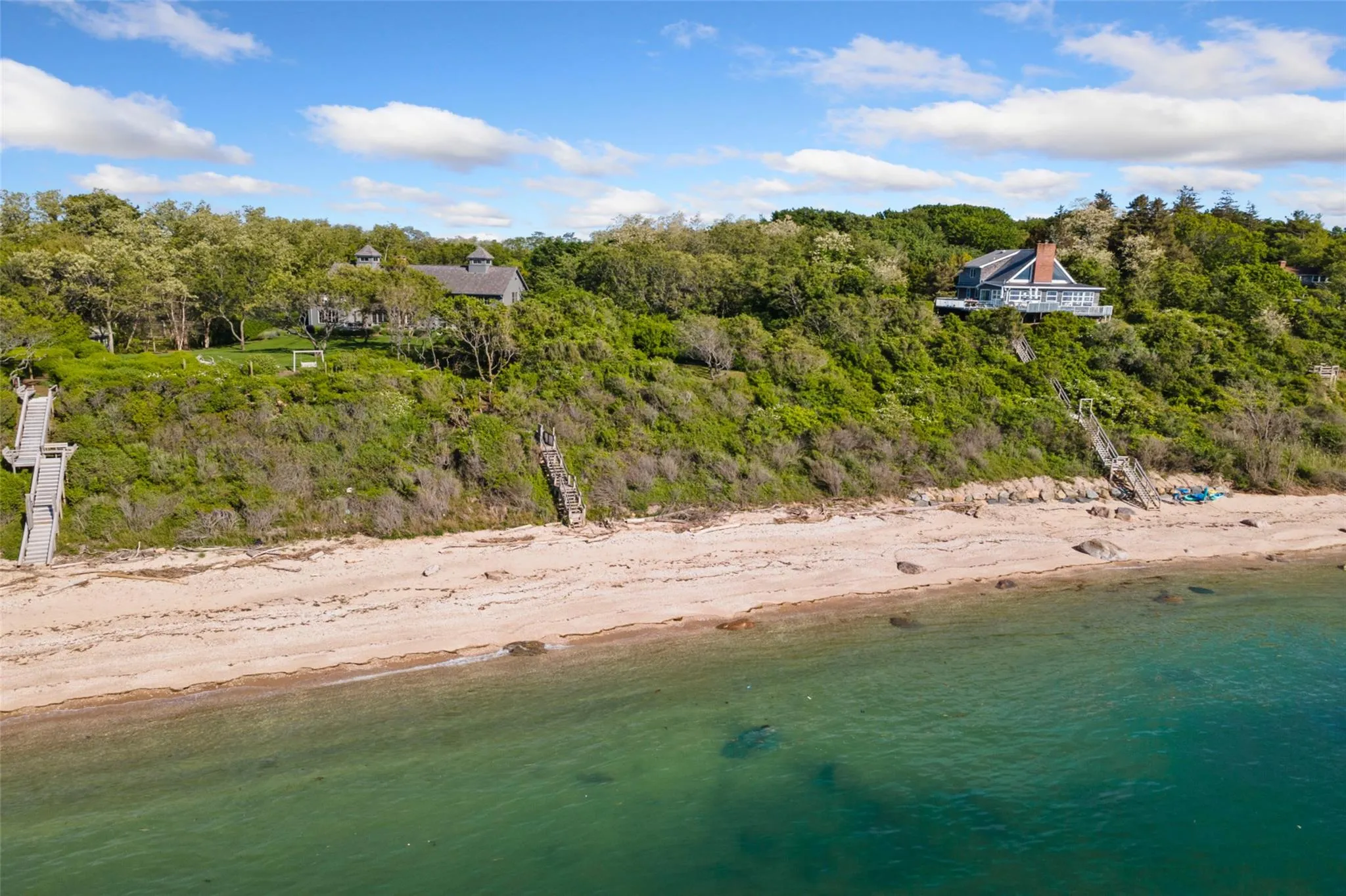 Bird\'s eye view of unending shoreline and a heavily wooded area Bird\'s eye view of unending shoreline and a heavily wooded area