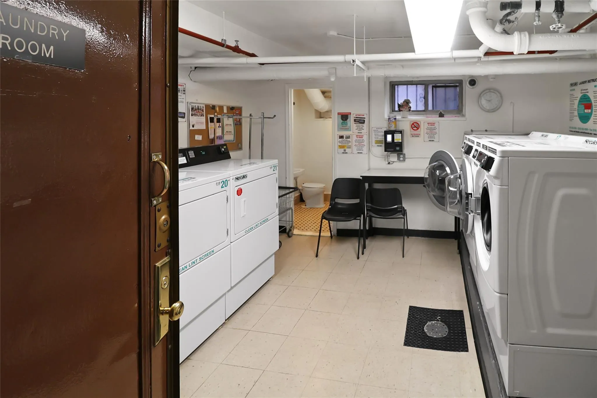 Community laundry with washing machine and clothes dryer Community laundry with washing machine and clothes dryer
