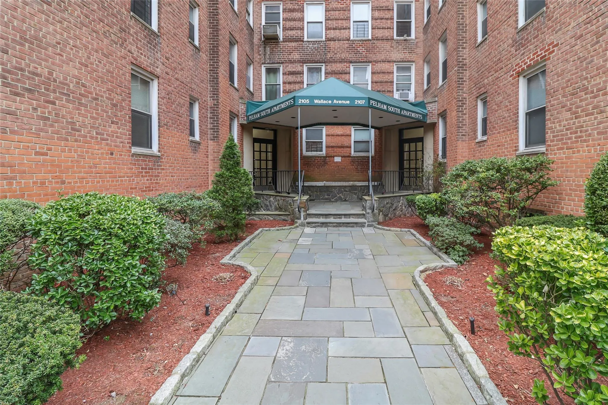 Property entrance with brick siding Property entrance with brick siding