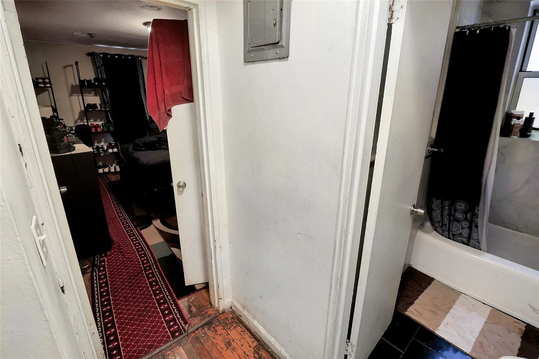 Bathroom with electric panel and baseboards Bathroom with electric panel and baseboards