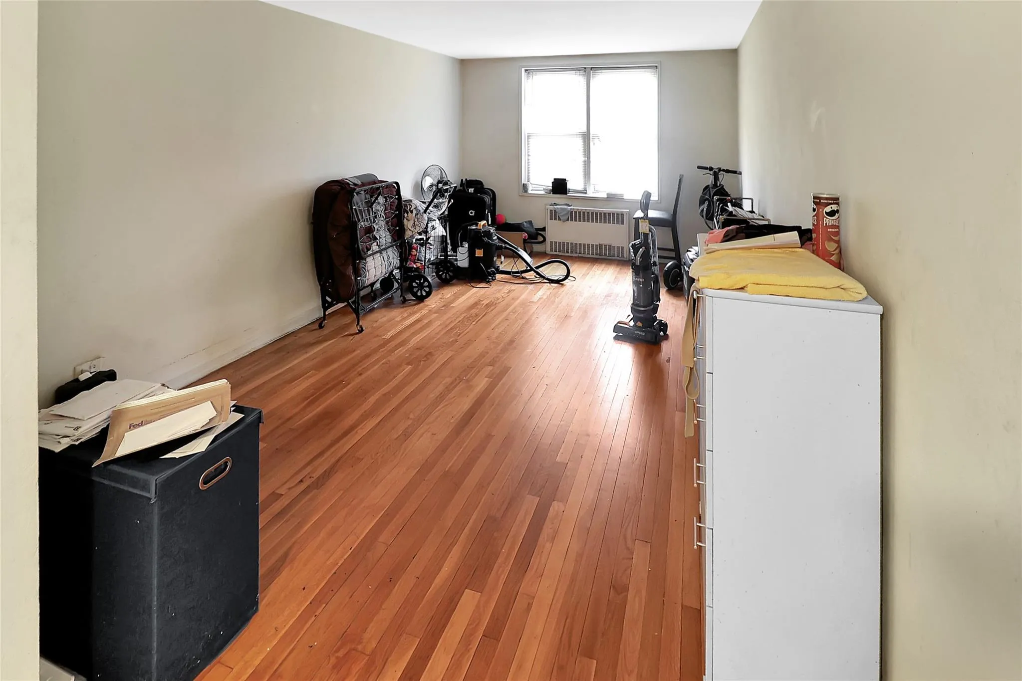 Exercise room featuring radiator heating unit and light wood-type flooring Exercise room featuring radiator heating unit and light wood-type flooring