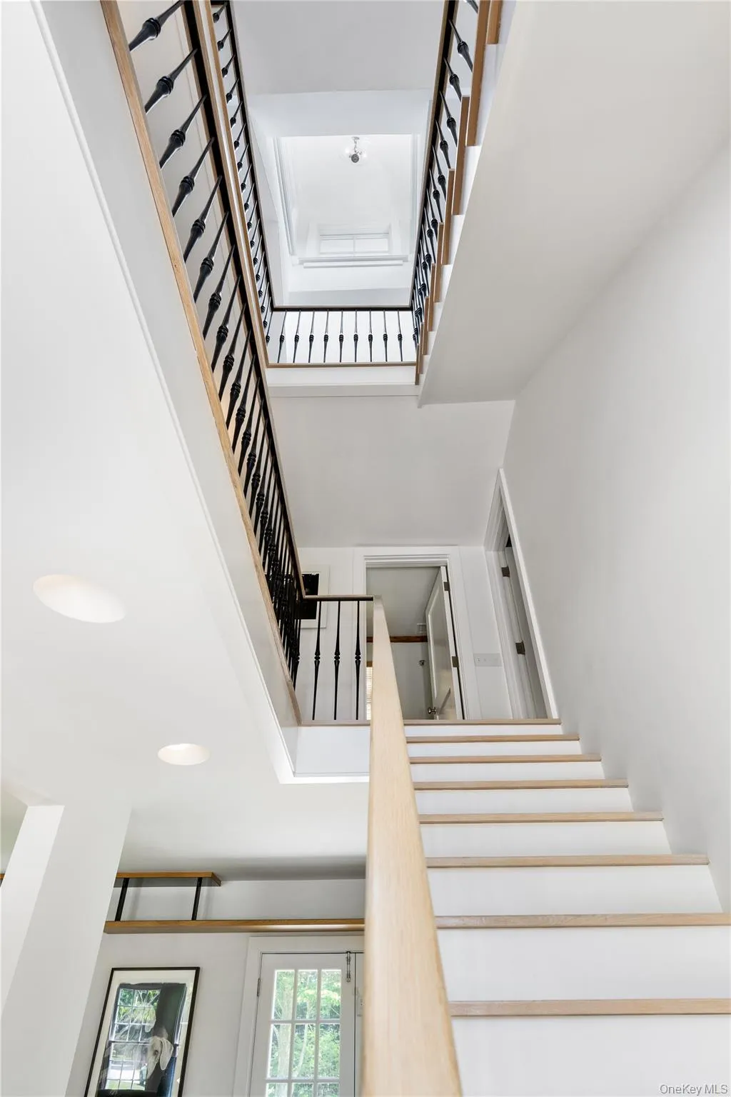 Staircase featuring a high ceiling Staircase featuring a high ceiling