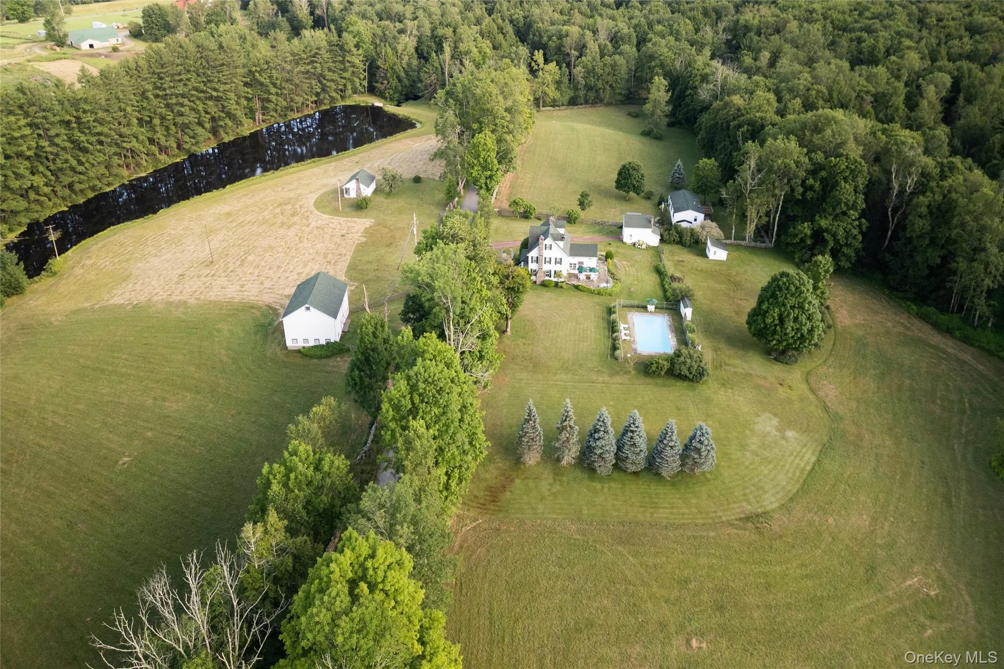Aerial view of property and surrounding area featuring a large body of water and rural landscape Aerial view of property and surrounding area featuring a large body of water and rural landscape