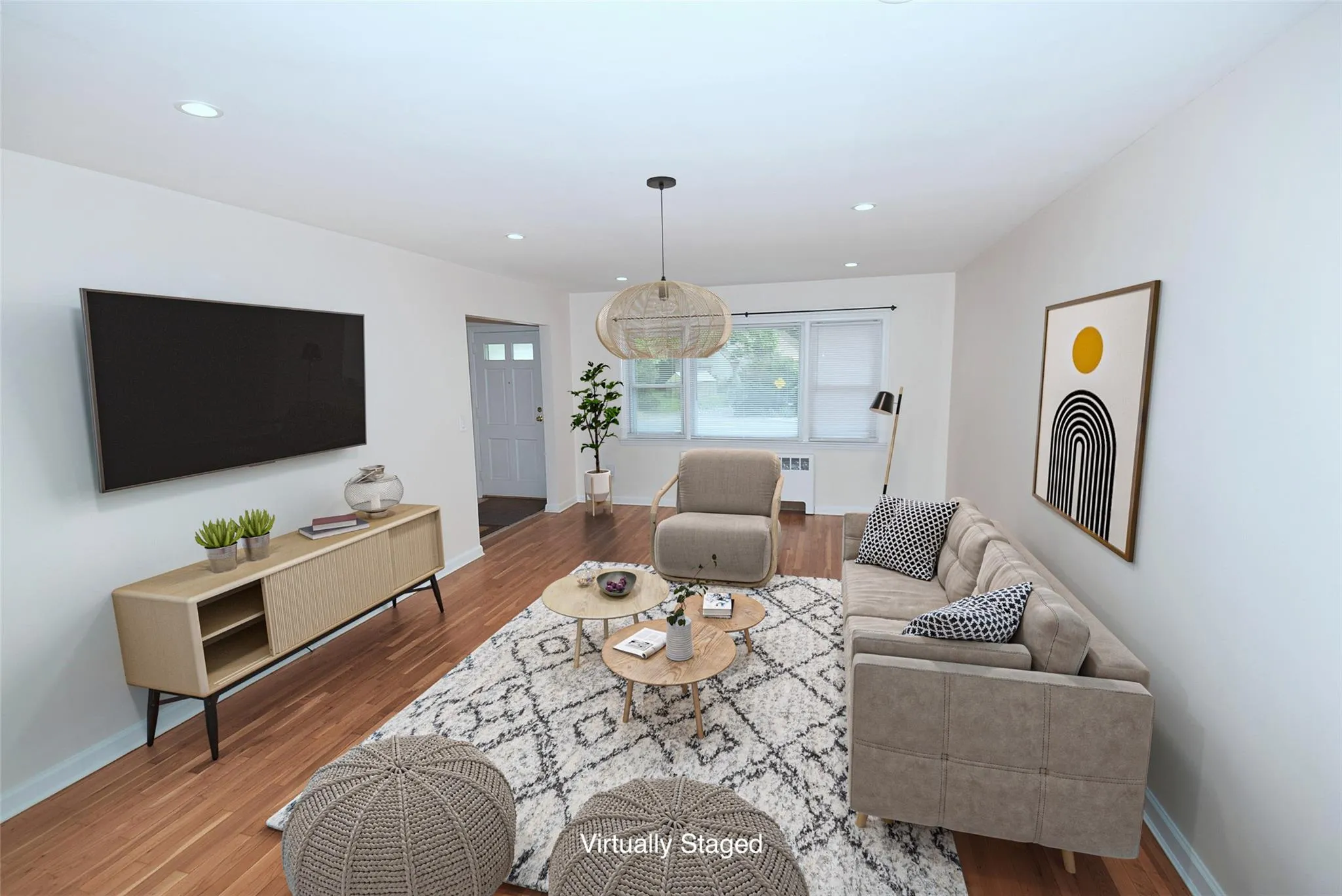 Living room featuring wood finished floors and recessed lighting Living room featuring wood finished floors and recessed lighting