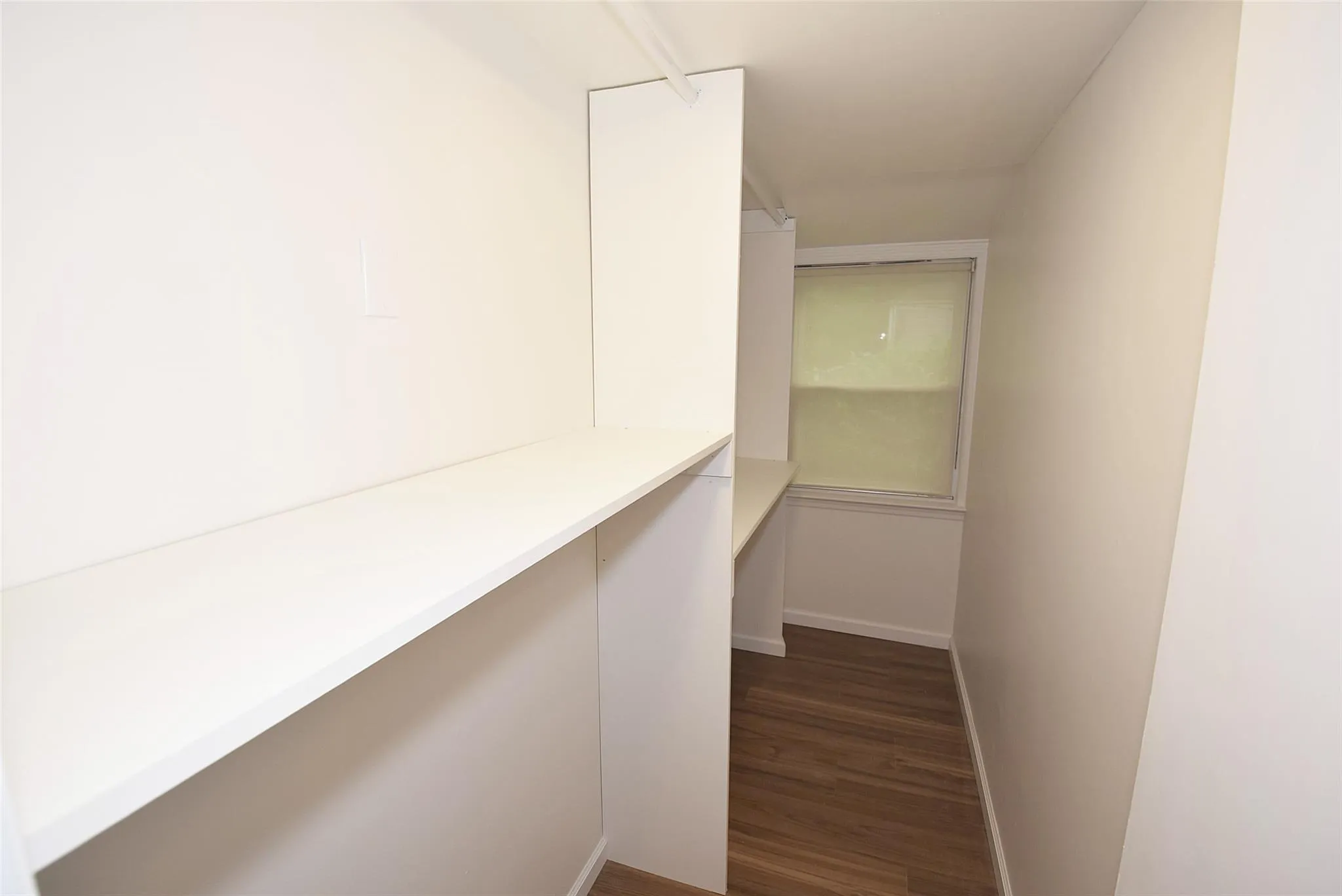 Spacious closet featuring wood finished floors Spacious closet featuring wood finished floors