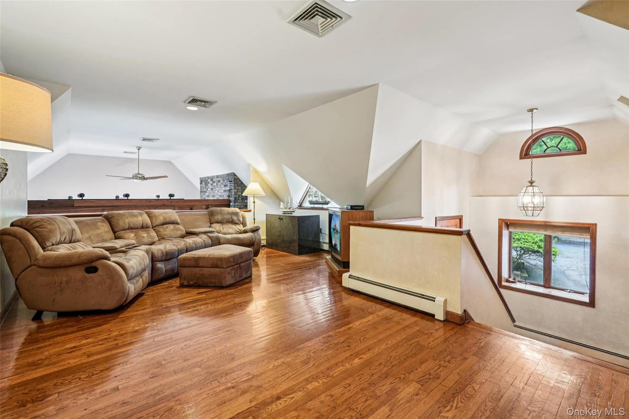 Living Room with vaulted ceiling and hardwood floors Living Room with vaulted ceiling and hardwood floors