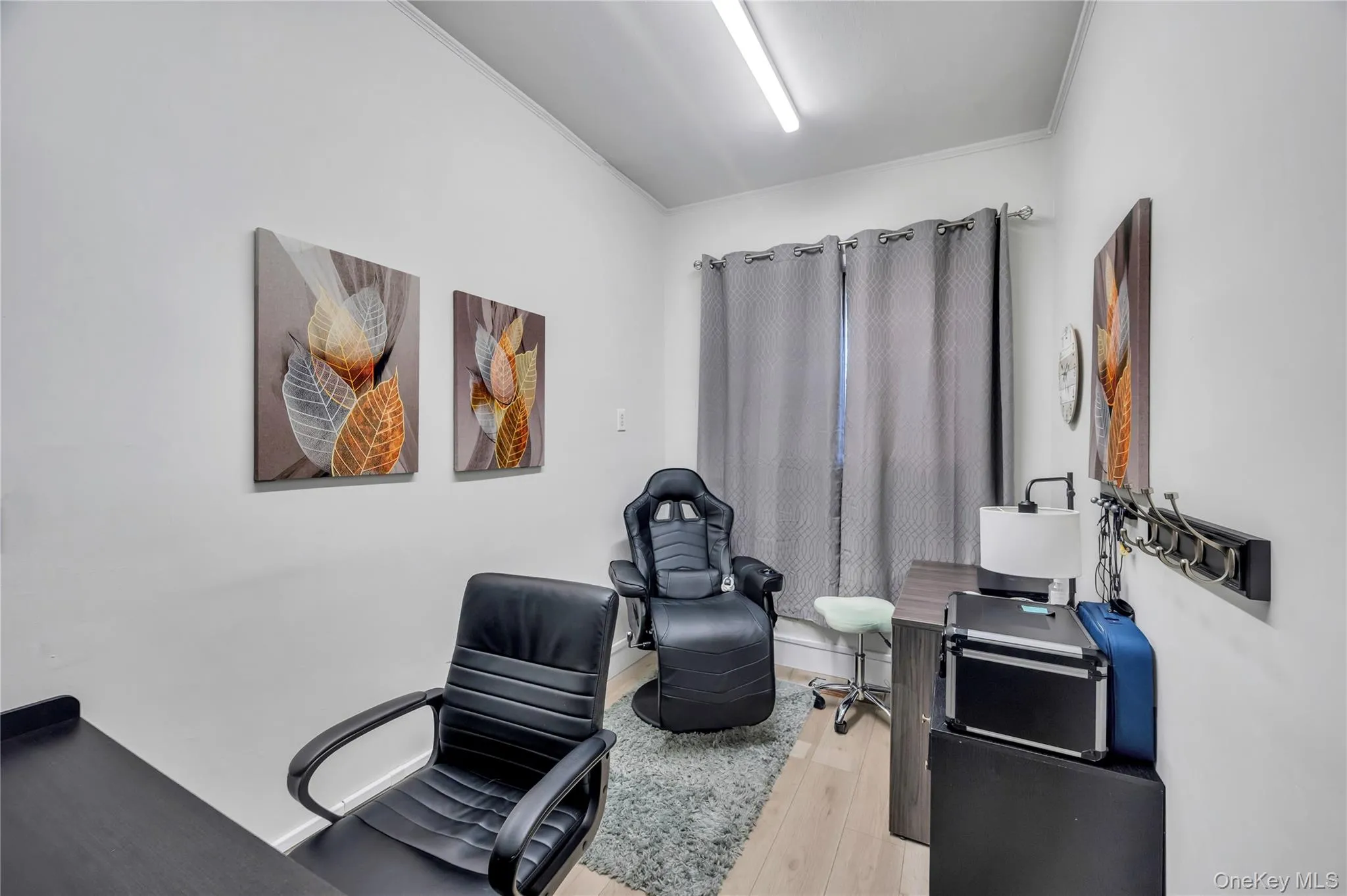 Office with wood finished floors and ornamental molding Office with wood finished floors and ornamental molding