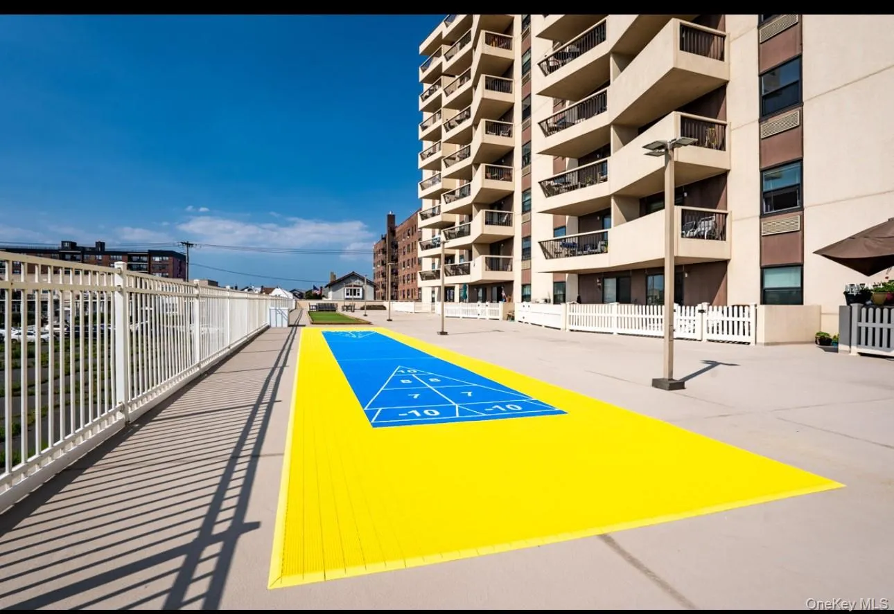 View of property's community with shuffleboard View of property's community with shuffleboard