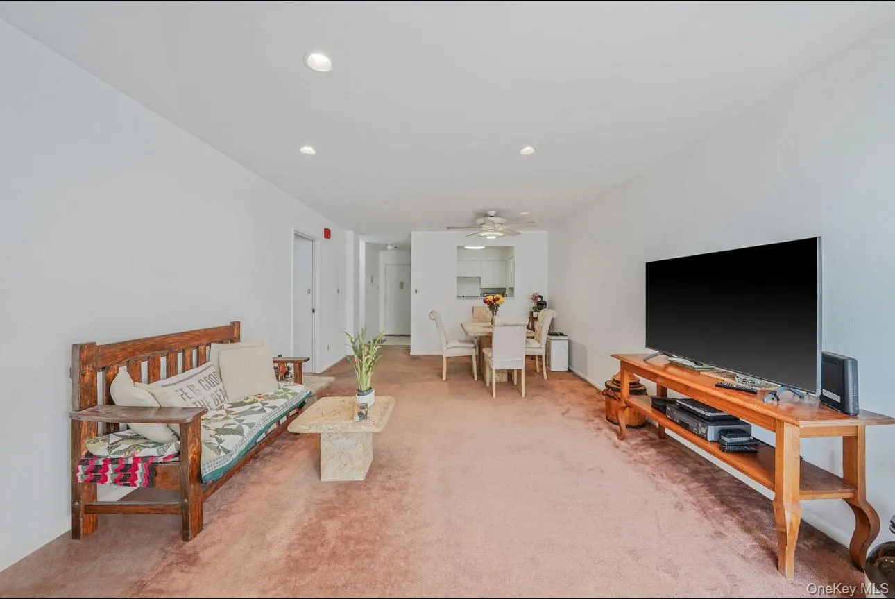 Carpeted living area featuring recessed lighting and ceiling fan Carpeted living area featuring recessed lighting and ceiling fan